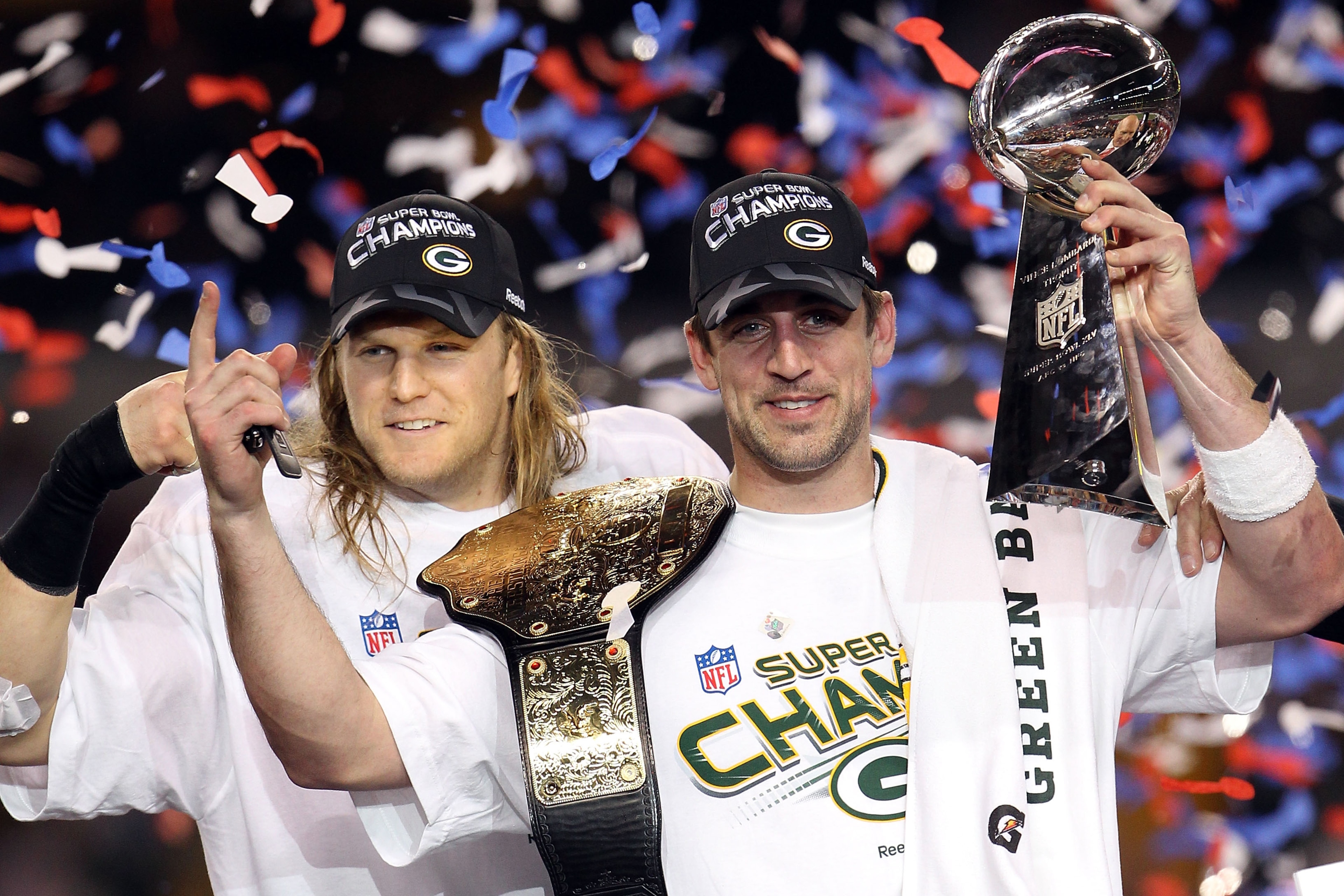 ARLINGTON, TX - FEBRUARY 06:  Aaron Rodgers #12 and Clay Matthews #52 of the Green Bay Packers of the Green Bay Packers holds the Lombardi Trophy after defeating the Pittsburgh Steelers 31-25 during Super Bowl XLV at Cowboys Stadium on February 6, 2011 in
