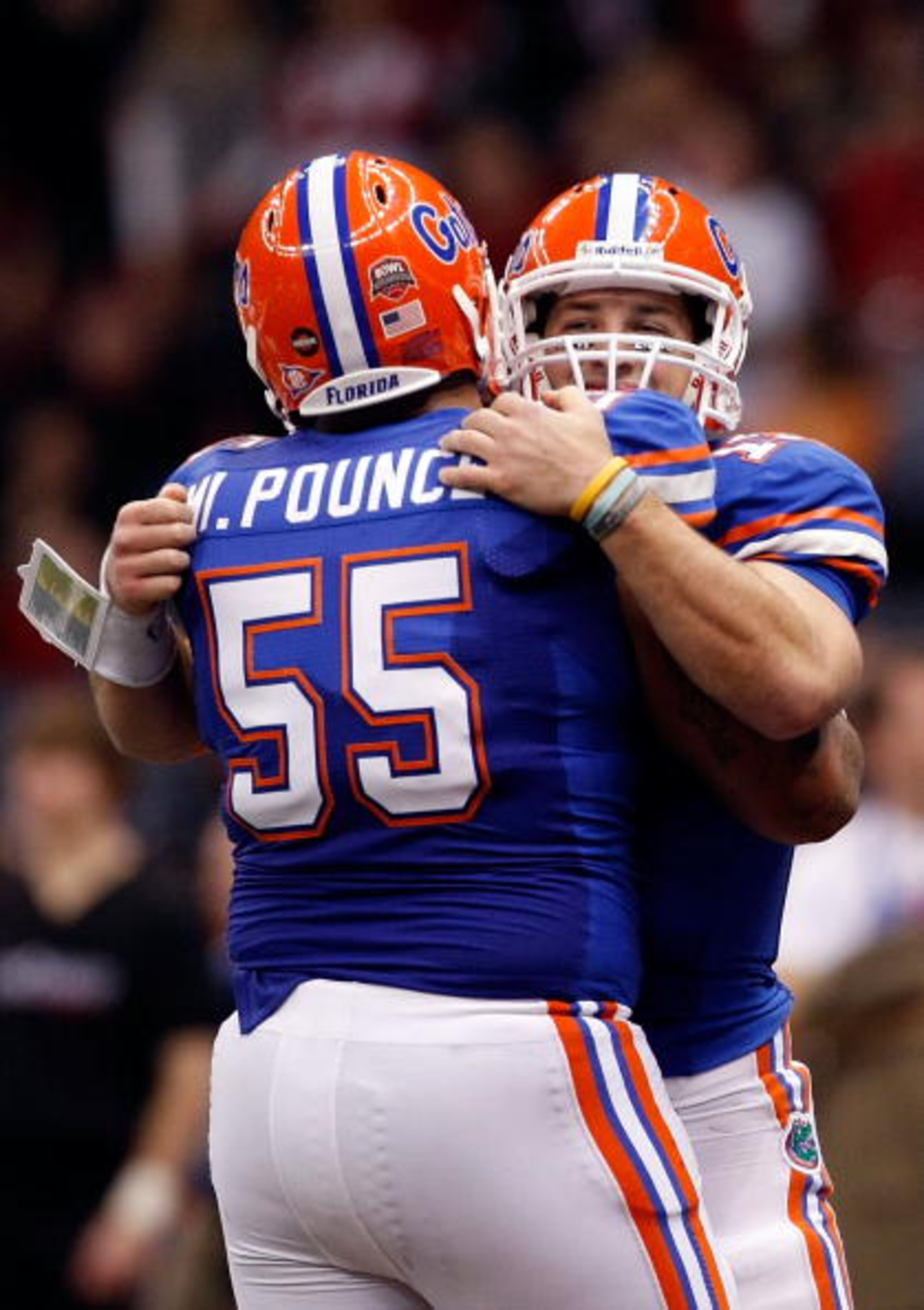 NEW ORLEANS - JANUARY 01: Tim Tebow #15 of the Florida Gators hugs teammate Mike Pouncey #55 after scoring a touchdown against the Cincinnati Bearcats during the Allstate Sugar Bowl at the Louisana Superdome on January 1, 2010 in New Orleans, Louisiana. NEW ORLEANS - JANUARY 01: Tim Tebow #15 of the Florida Gators hugs teammate Mike Pouncey #55 after scoring a touchdown against the Cincinnati Bearcats during the Allstate Sugar Bowl at the Louisana Superdome on January 1, 2010 in New Orleans, Louisiana.