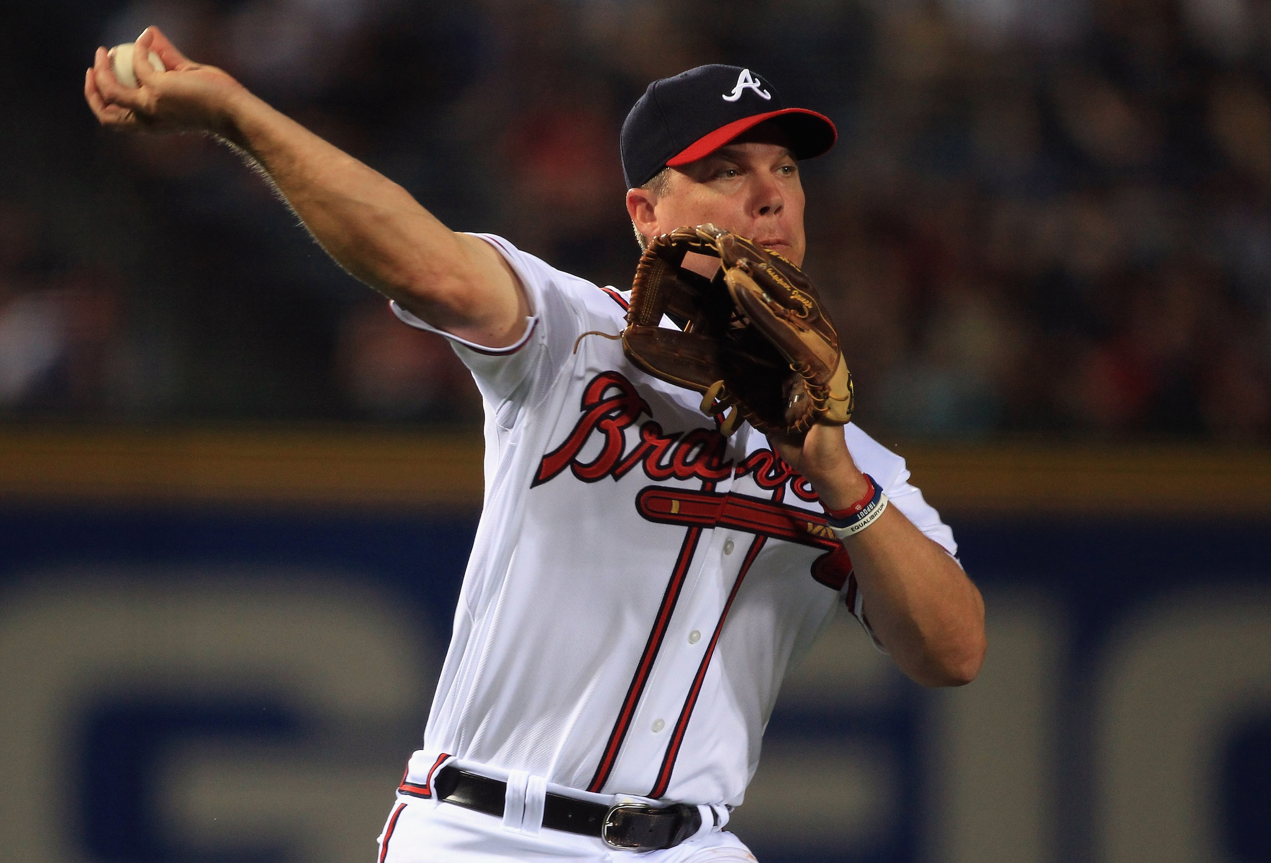 ATLANTA, GA - APRIL 08:  Chipper Jones #10 of the Atlanta Braves throws out a runner at first base during their opening day game against the Philadephia Phillies at Turner Field on April 8, 2011 in Atlanta, Georgia.  (Photo by Streeter Lecka/Getty Images)