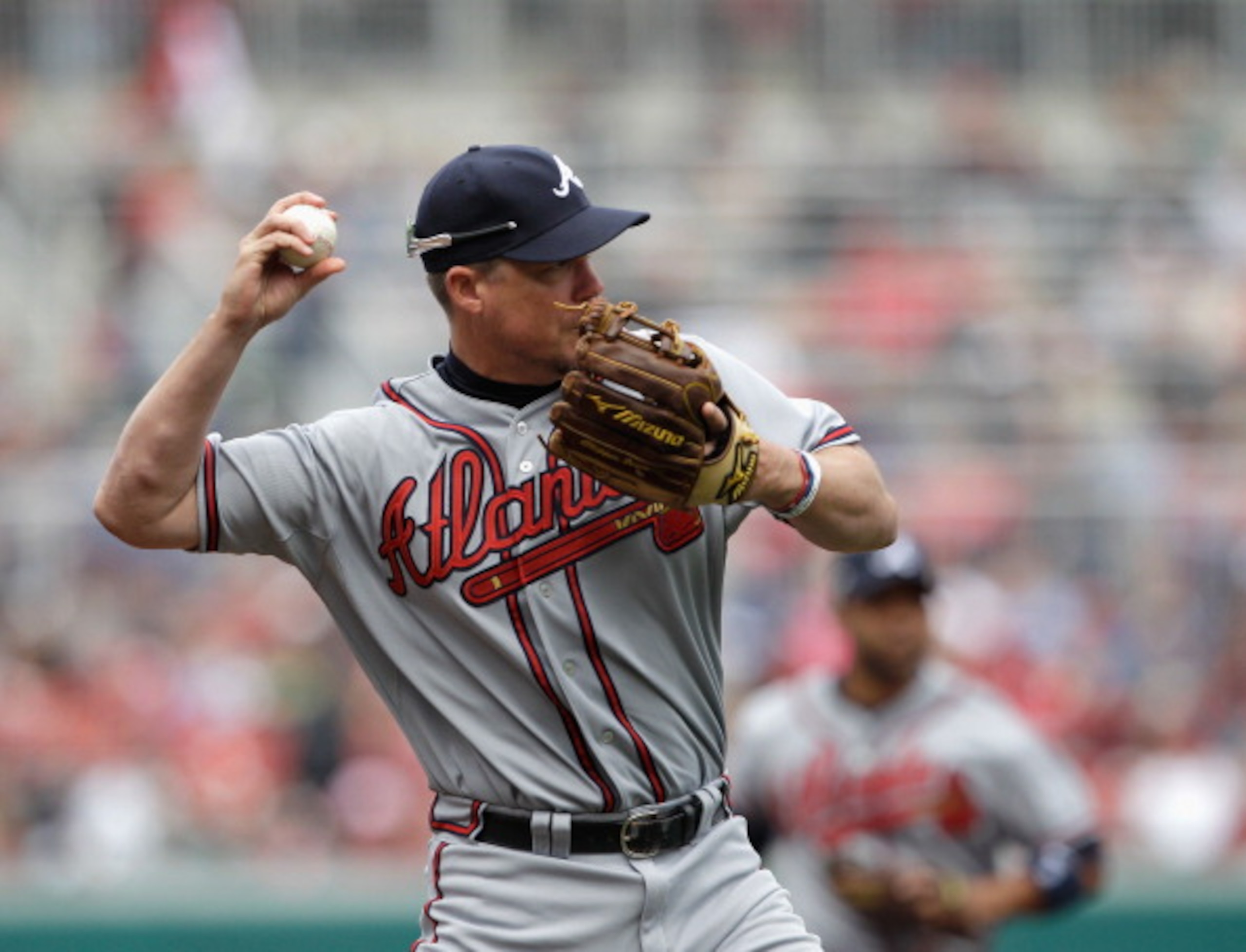 WASHINGTON, DC - APRIL 03:  Third baseman Chipper Jones #10 of the Atlanta Braves makes a throw against the Washington Nationals at Nationals Park on April 3, 2011 in Washington, DC.  (Photo by Rob Carr/Getty Images)