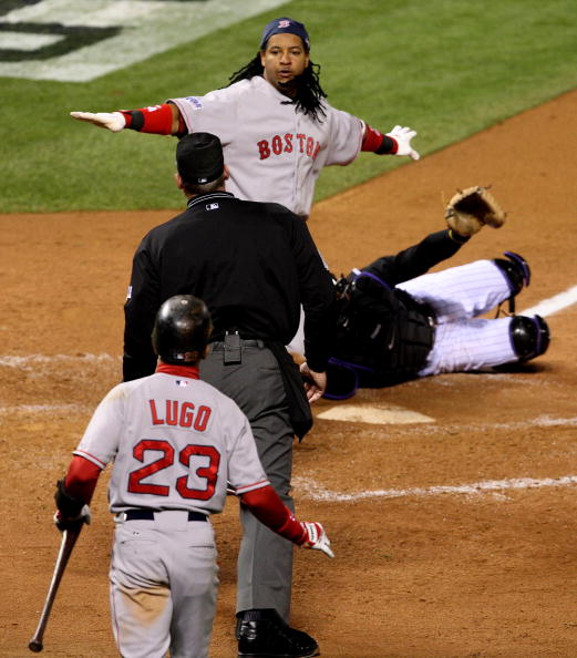 DENVER - OCTOBER 27:  Manny Ramirez #24 of the Boston Red Sox argues with home plate umpire Ted Barrett after Ramirez was called out on a play at theplate in the top of the third inning against the Colorado Rockies during Game Three of the 2007 Major Leag