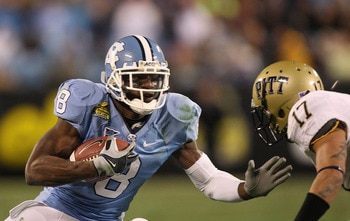 CHARLOTTE, NC - DECEMBER 26:  Aaron Berry #17 of the Pittsburgh Panthers tackles Greg Little #8 of the North Carolina Tar Heels during their game on December 26, 2009 in Charlotte, North Carolina.  (Photo by Streeter Lecka/Getty Images)