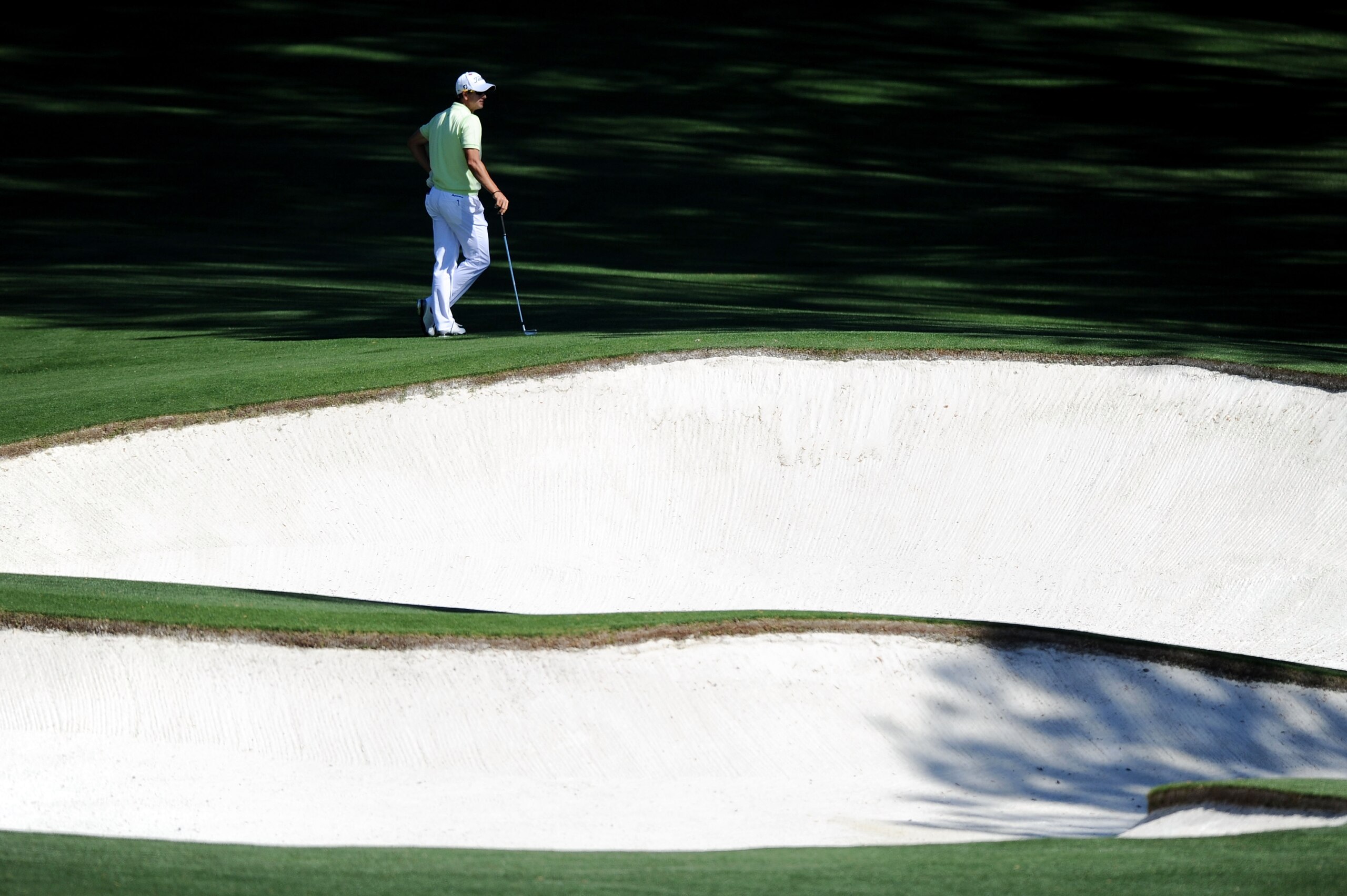 AUGUSTA, GA - APRIL 06: Adam Scott of Australia waits near a bunker during a practice round prior to the 2011 Masters Tournament at Augusta National Golf Club on April 6, 2011 in Augusta, Georgia. (Photo by Harry How/Getty Images) AUGUSTA, GA - APRIL 06: Adam Scott of Australia waits near a bunker during a practice round prior to the 2011 Masters Tournament at Augusta National Golf Club on April 6, 2011 in Augusta, Georgia. (Photo by Harry How/Getty Images)
