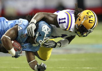 ATLANTA - SEPTEMBER 4: Kelvin Sheppard #11 of the LSU Tigers tackles Johnny White #34 of the North Carolina Tar Heels at the Georgia Dome September 4, 2010 in Atlanta, Georgia.  (Photo by Kevin C. Cox/Getty Images)