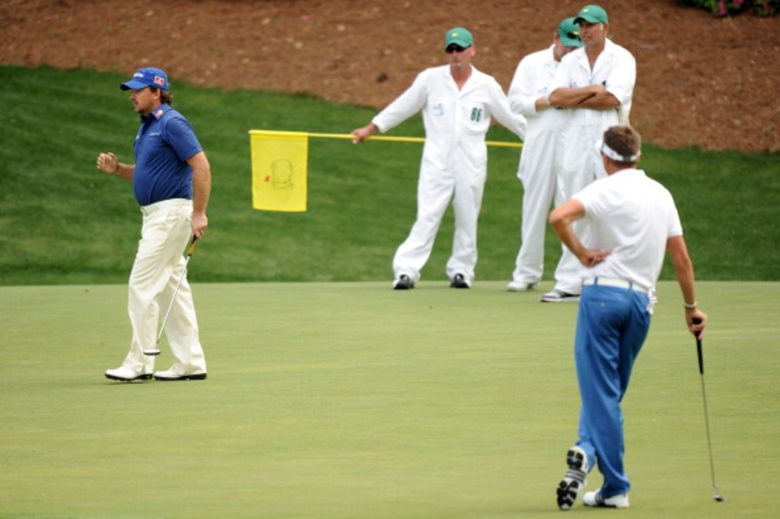 AUGUSTA, GA - APRIL 08: Graeme McDowell of Northern Ireland watches a putt as Robert Allenby of Australia looks on during the second round of the 2011 Masters Tournament at Augusta National Golf Club on April 8, 2011 in Augusta, Georgia. (Photo by Harr AUGUSTA, GA - APRIL 08: Graeme McDowell of Northern Ireland watches a putt as Robert Allenby of Australia looks on during the second round of the 2011 Masters Tournament at Augusta National Golf Club on April 8, 2011 in Augusta, Georgia. (Photo by Harr