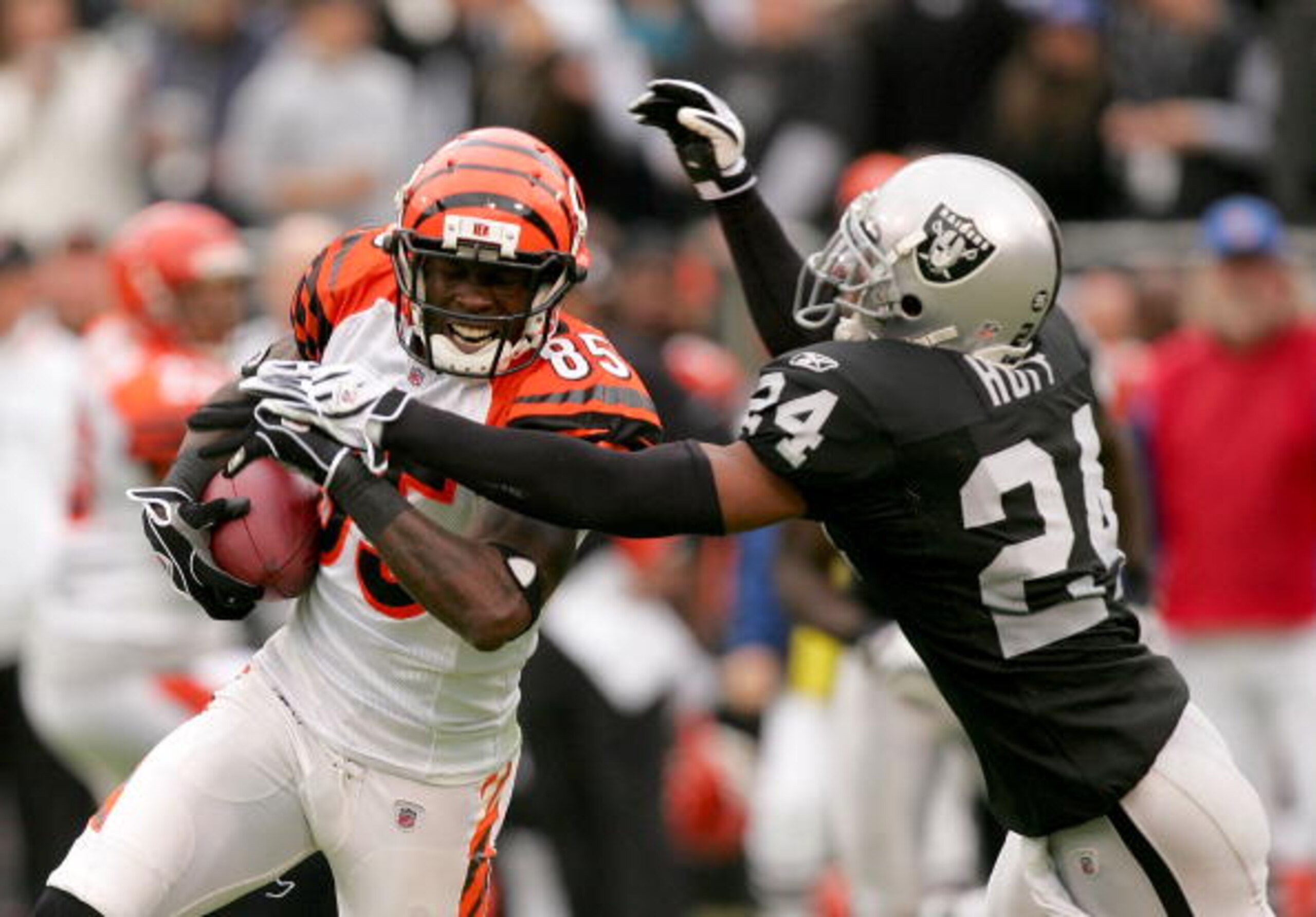 OAKLAND, CA - NOVEMBER 22: Chad Ochocinco #85 of the Cincinnati Bengals is tackled by Michael Huff #24 of the Oakland Raiders at Oakland-Alameda County Coliseum on November 22, 2009 in Oakland, California. (Photo by Ezra Shaw/Getty Images) OAKLAND, CA - NOVEMBER 22: Chad Ochocinco #85 of the Cincinnati Bengals is tackled by Michael Huff #24 of the Oakland Raiders at Oakland-Alameda County Coliseum on November 22, 2009 in Oakland, California. (Photo by Ezra Shaw/Getty Images)