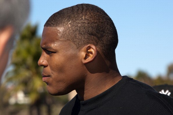 SAN DIEGO, CA - FEBRUARY 10: 2010 Heisman Trophy winning quarterback Cam Newton of Auburn answers questions after his workout routine for the media at Cathedral High School's sports stadium on February 10, 2011 in San Diego, California. (Photo by Kent Hor
