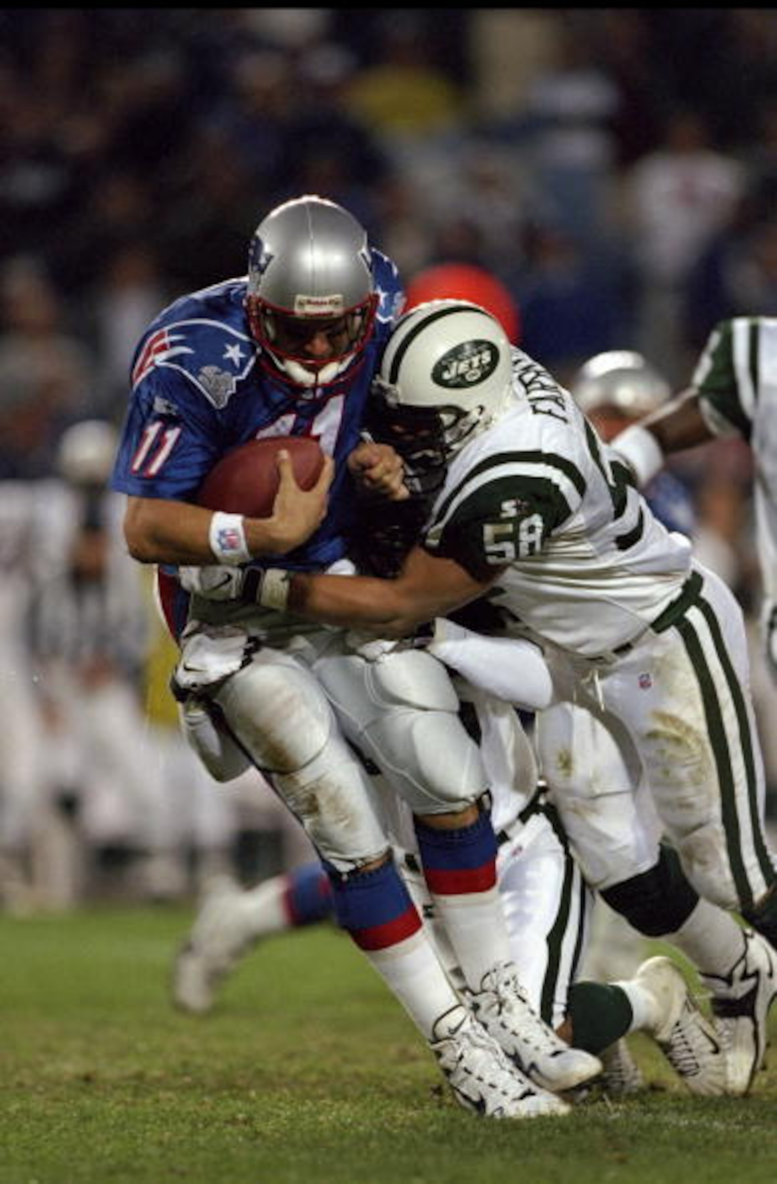19 Oct 1998: Quarterback Drew Bledsoe #11 of the New England Patriots is sacked by James Farrior #58 of the New York Jets at Foxboro Stadium in Foxboro, Massachusetts. The Jets defeated the Patriots 24-14. 19 Oct 1998: Quarterback Drew Bledsoe #11 of the New England Patriots is sacked by James Farrior #58 of the New York Jets at Foxboro Stadium in Foxboro, Massachusetts. The Jets defeated the Patriots 24-14.