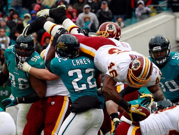 JACKSONVILLE, FL - DECEMBER 26:  Ryan Torain #46 of the Washington Redskins dives for a touchdown over Don Carey #22 of the Jacksonville Jaguars during the game at EverBank Field on December 26, 2010 in Jacksonville, Florida.  (Photo by Sam Greenwood/Gett