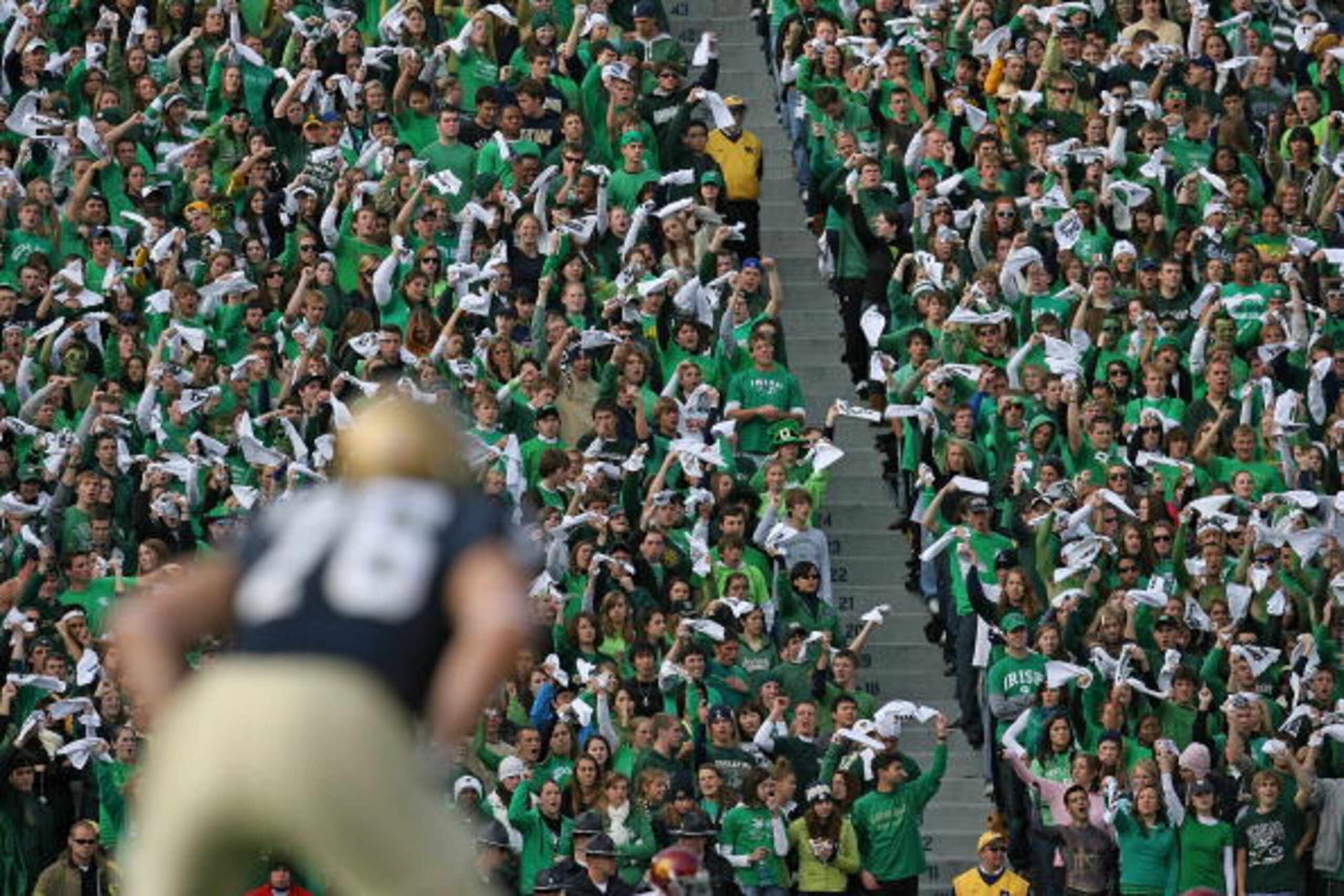 SOUTH BEND, IN - OCTOBER 17: Student fans of the Notre Dame Fighting Irish wave towels before a kick-off against the USC Trojans at Notre Dame Stadium on October 17, 2009 in South Bend, Indiana. USC defeated Notre Dame 34-27. (Photo by Jonathan Daniel/Get SOUTH BEND, IN - OCTOBER 17: Student fans of the Notre Dame Fighting Irish wave towels before a kick-off against the USC Trojans at Notre Dame Stadium on October 17, 2009 in South Bend, Indiana. USC defeated Notre Dame 34-27. (Photo by Jonathan Daniel/Get