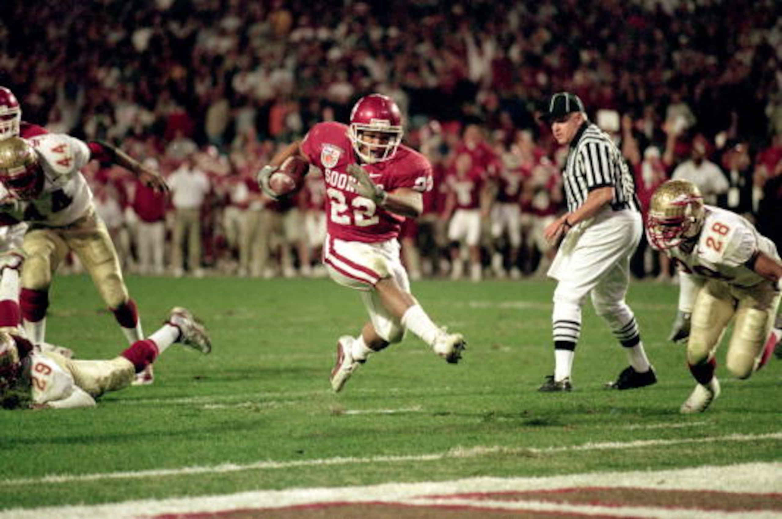 3 Jan 2001: Quentin Griffin #22 of the Oklahoma Sooners carries the ball in for a touchdown during the Orange Bowl Game against the Florida State Seminoles at the Pro Players Stadium in Miami, Florida. The Sooners defeated the Seminoles 13-2. Mandatory 3 Jan 2001: Quentin Griffin #22 of the Oklahoma Sooners carries the ball in for a touchdown during the Orange Bowl Game against the Florida State Seminoles at the Pro Players Stadium in Miami, Florida. The Sooners defeated the Seminoles 13-2. Mandatory