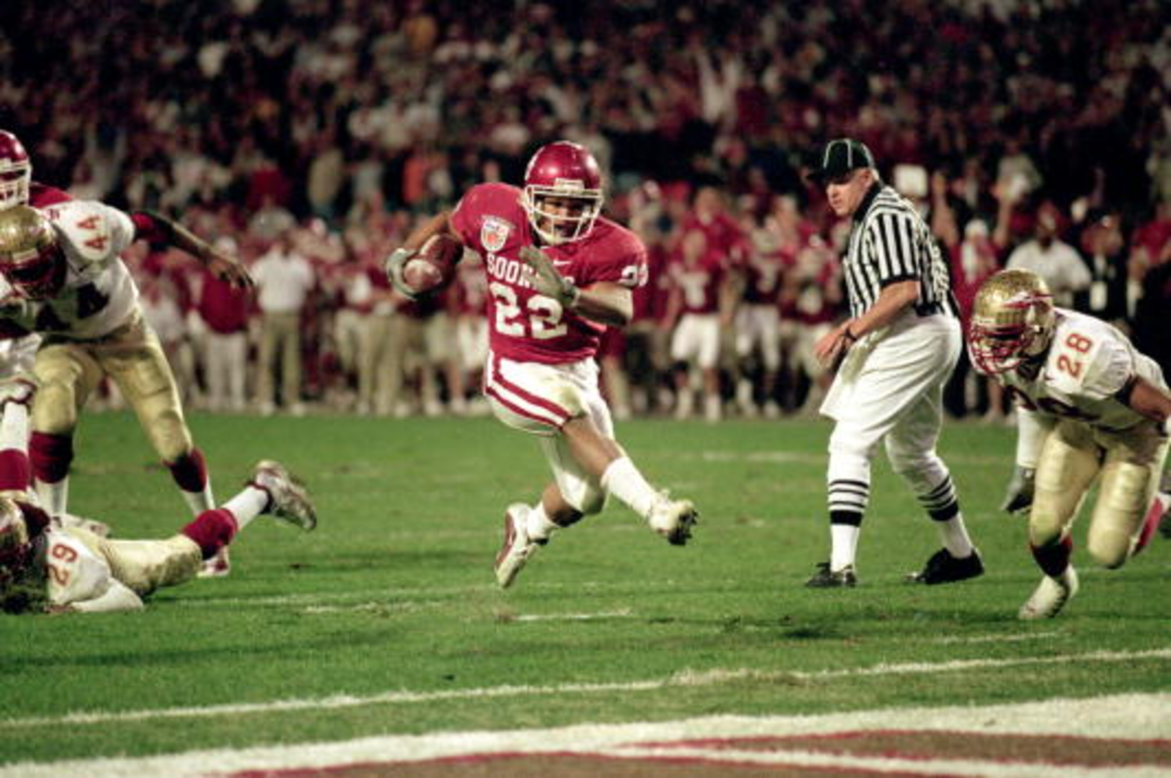 3 Jan 2001: Quentin Griffin #22 of the Oklahoma Sooners carries the ball in for a touchdown during the Orange Bowl Game against the Florida State Seminoles at the Pro Players Stadium in Miami, Florida. The Sooners defeated the Seminoles 13-2. Mandatory 3 Jan 2001: Quentin Griffin #22 of the Oklahoma Sooners carries the ball in for a touchdown during the Orange Bowl Game against the Florida State Seminoles at the Pro Players Stadium in Miami, Florida. The Sooners defeated the Seminoles 13-2. Mandatory