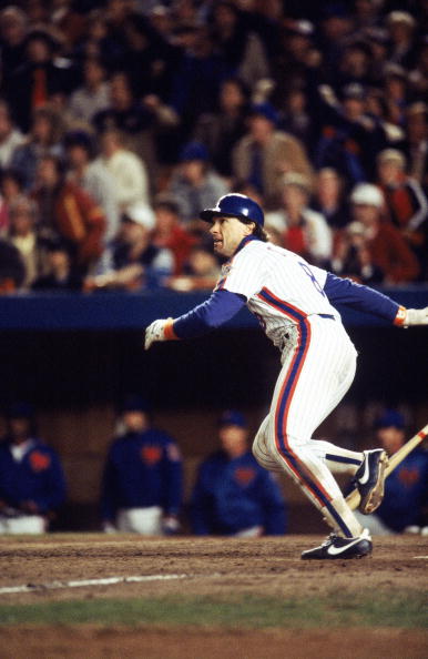 FLUSHING, NY - OCTOBER 27:  Gary Carter #8 of the New York Mets runs to first base during Game seven of the 1986 World Series against the Boston Red Sox at Shea Stadium on October 27, 1986 in Flushing, New York. The Mets defeated the Red Sox 8-5 to win th