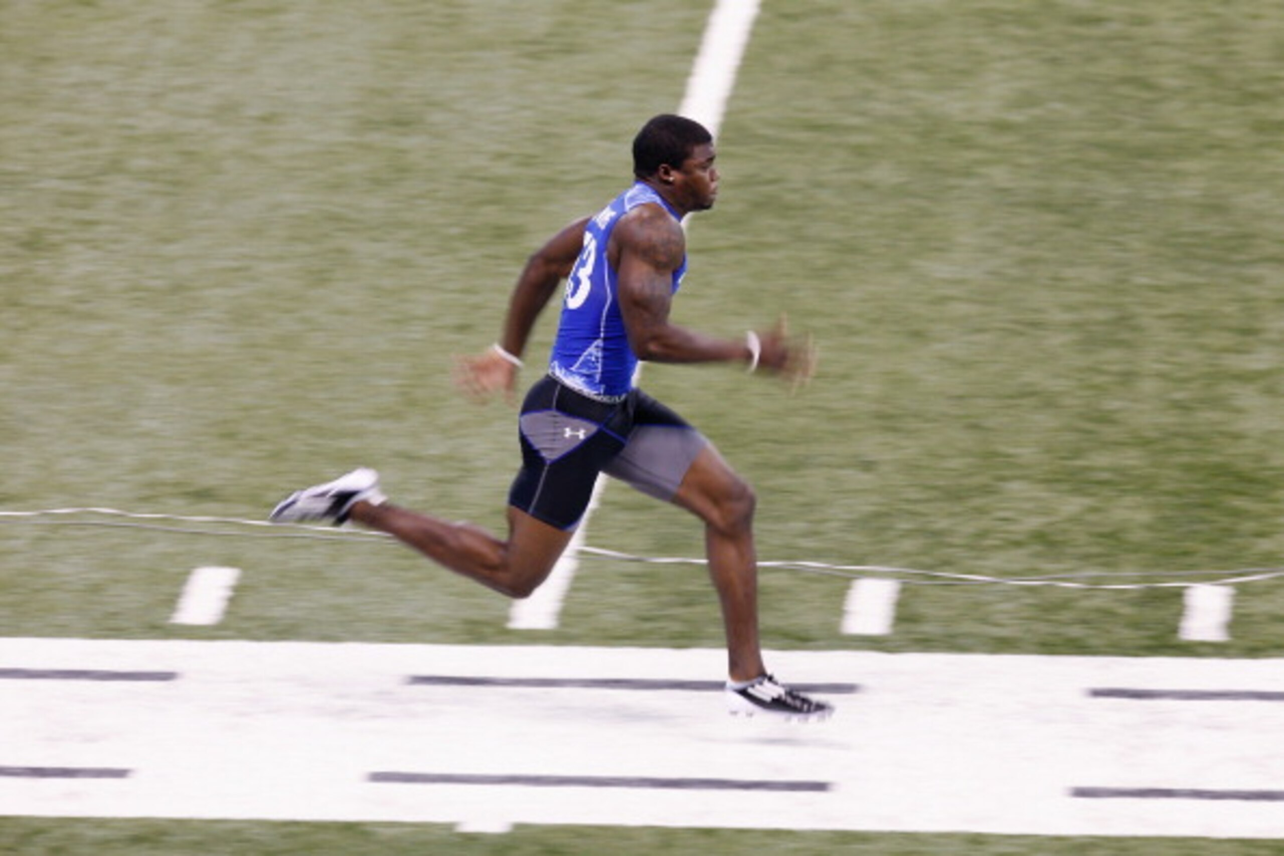 INDIANAPOLIS, IN - MARCH 1: Defensive back Aaron Williams #53 runs the 40-yard dash during the 2011 NFL Scouting Combine at Lucas Oil Stadium on February 28, 2011 in Indianapolis, Indiana. (Photo by Joe Robbins/Getty Images)