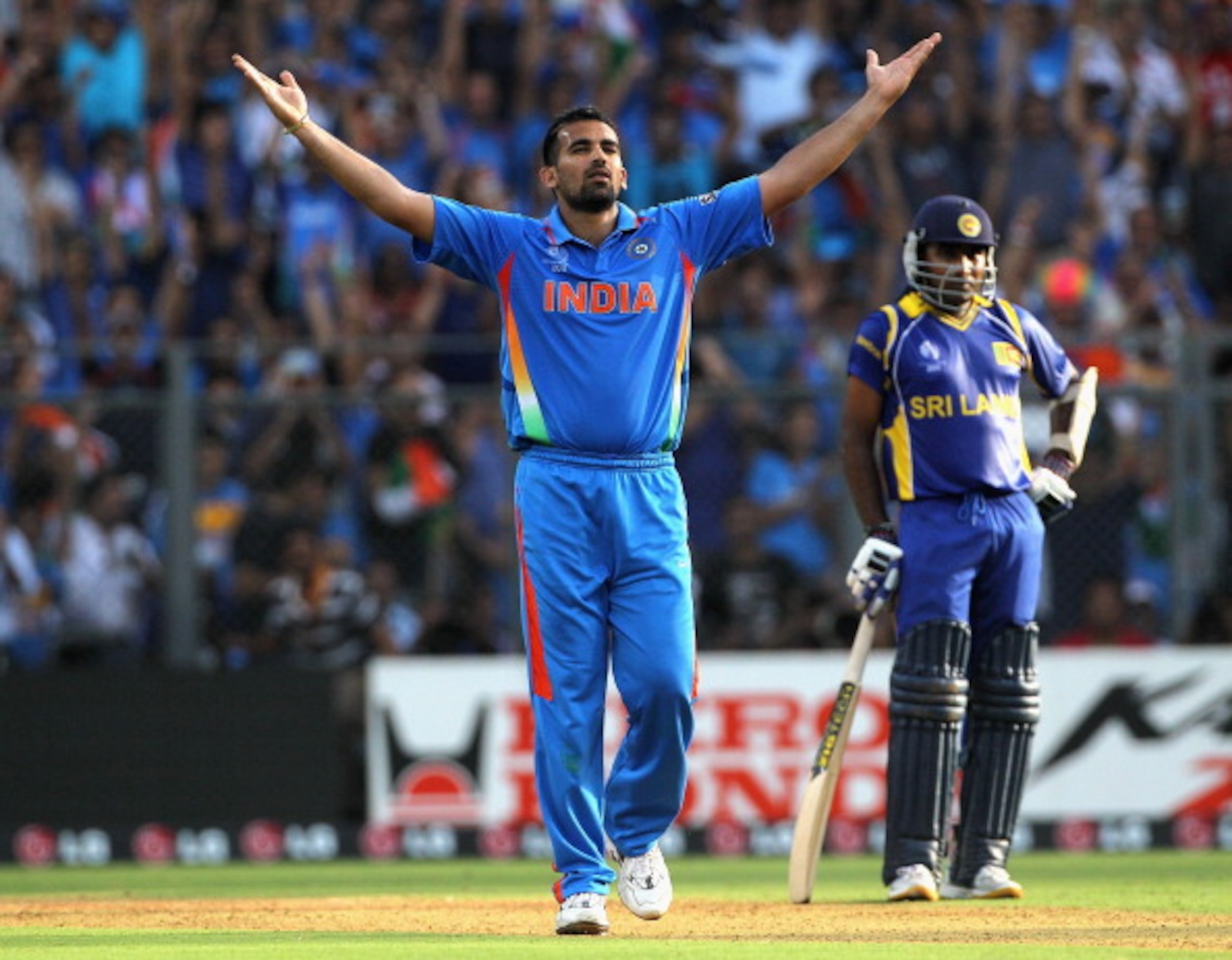 MUMBAI, INDIA - APRIL 02:  Zaheer Khan of India celebrates after taking the wicket of Chamara Kapugedera of Sri Lanka with Mahela Jayawardene of Sri Lanka looking on during the 2011 ICC World Cup Final between India and Sri Lanka at Wankhede Stadium on Ap