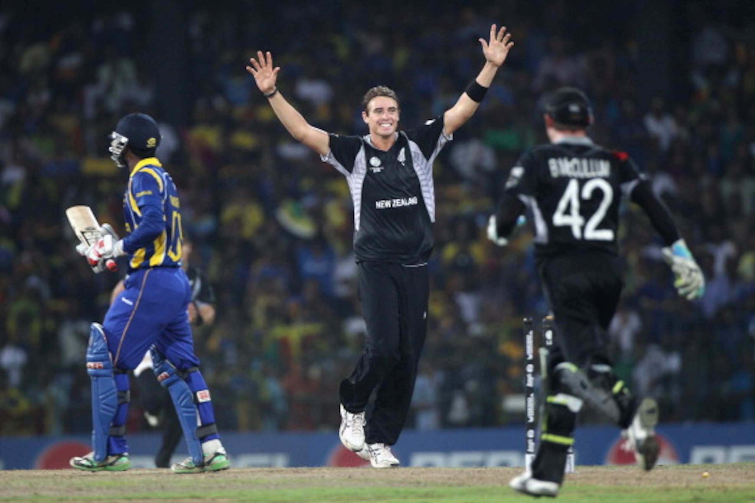 COLOMBO, SRI LANKA - MARCH 29:  Tim Southee (C) of New Zealand celebrates bowling Chamara Silva (L) during the 2011 ICC World Cup Semi-Final match between New Zealand and Sri Lanka at the R. Premadasa Stadium on March 29, 2011 in Colombo, Sri Lanka.  (Pho
