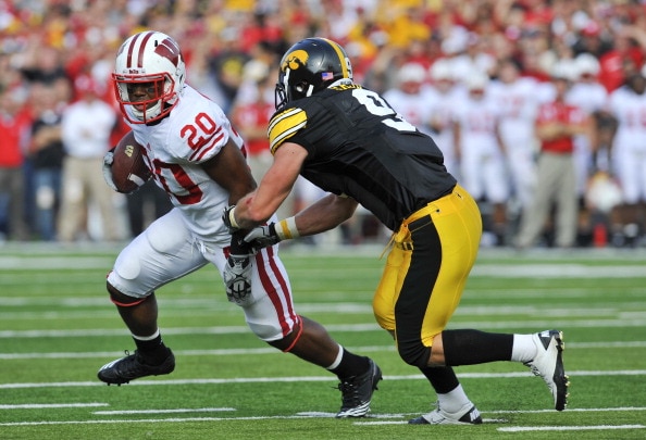 IOWA CITY, IA - OCTOBER 23: Defensive back Tyler Sash #9 of the University of Iowa Hawkeyes closes in on running back James White #20 of the Wisconsin Badgers as he rushes for yards during the first half of play at Kinnick Stadium on October 23, 2010 in I