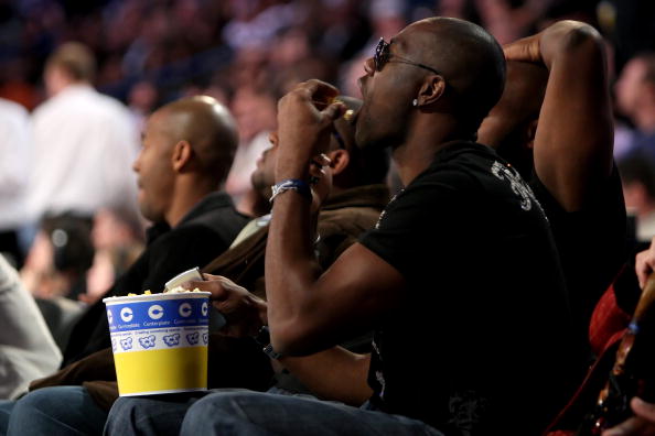 NEW ORLEANS - FEBRUARY 16: NFL star Terrell Owens eats popcorn as he sits courtside at NBA All-Star Saturday Night, part of 2008 NBA All-Star Weekend at the New Orleans Arena on February 16, 2008 in New Orleans, Louisiana. NOTE TO USER: User expressly ack