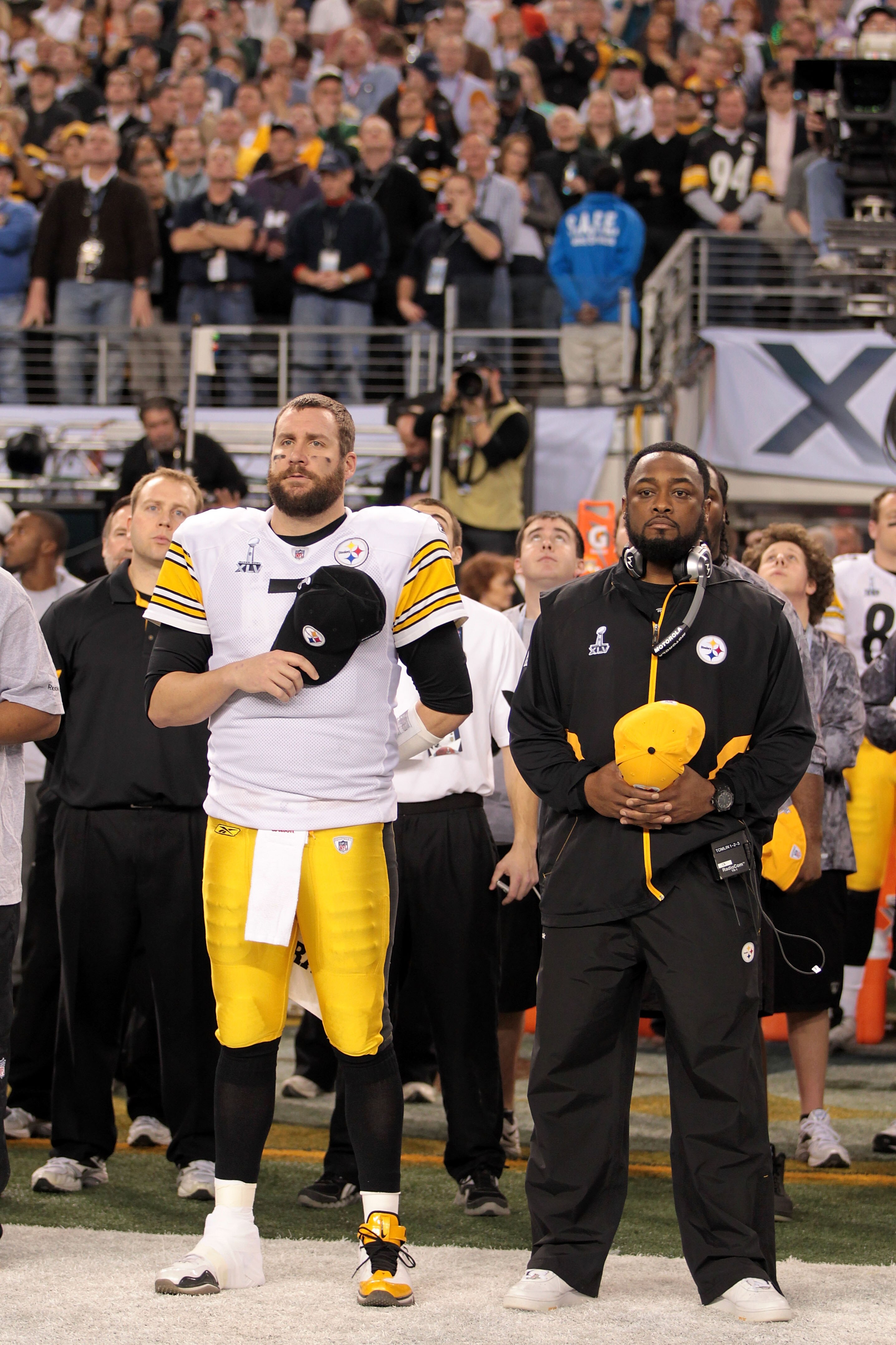 ARLINGTON, TX - FEBRUARY 06:  Ben Roethlisberger #7 and head coach Mike Tomlin of the Pittsburgh Steelers look on during the National Anthem during Super Bowl XLV at Cowboys Stadium on February 6, 2011 in Arlington, Texas.  (Photo by Jamie Squire/Getty Im