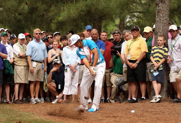 AUGUSTA, GA - APRIL 08:  Rickie Fowler hits his shot from the rough on the 11th hole during the second round of the 2011 Masters Tournament at Augusta National Golf Club on April 8, 2011 in Augusta, Georgia.  (Photo by Andrew Redington/Getty Images)