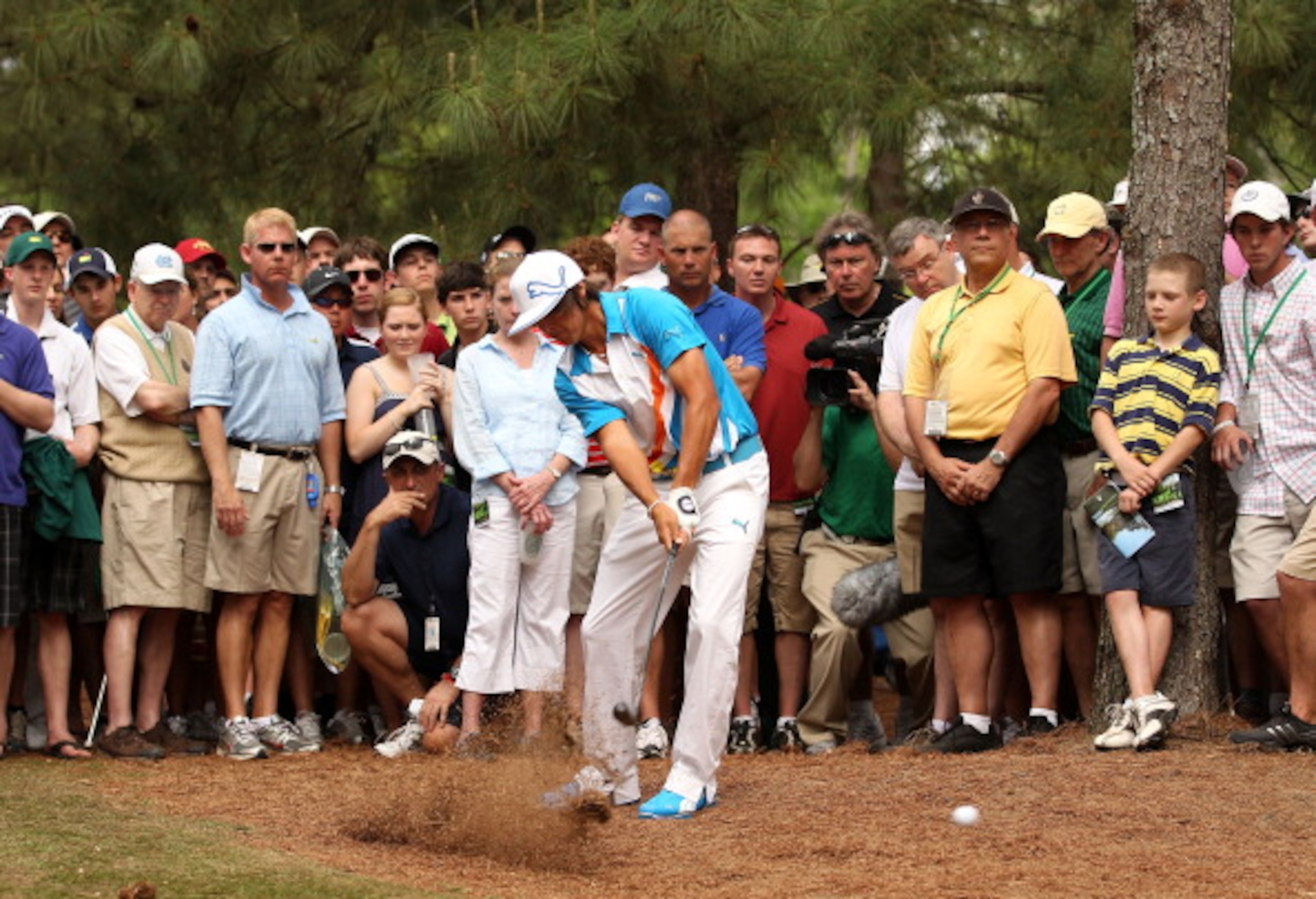 AUGUSTA, GA - APRIL 08:  Rickie Fowler hits his shot from the rough on the 11th hole during the second round of the 2011 Masters Tournament at Augusta National Golf Club on April 8, 2011 in Augusta, Georgia.  (Photo by Andrew Redington/Getty Images)
