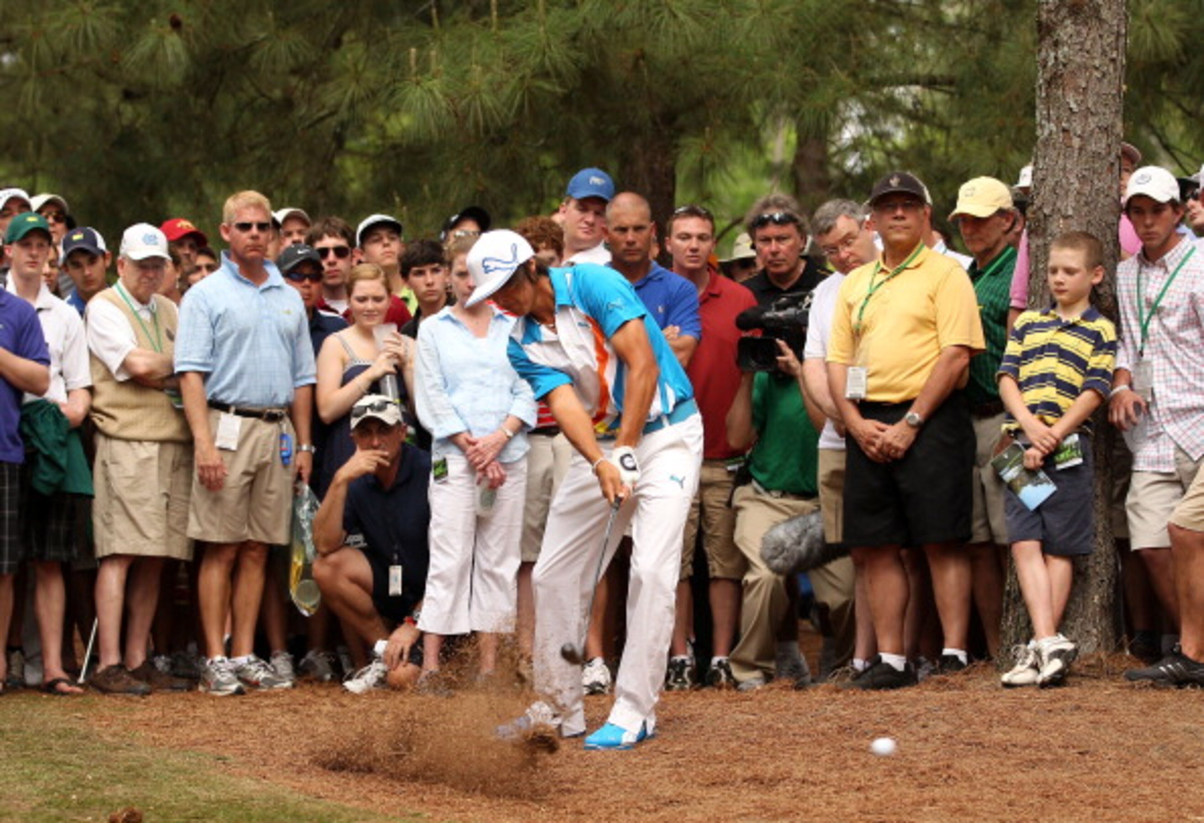 AUGUSTA, GA - APRIL 08:  Rickie Fowler hits his shot from the rough on the 11th hole during the second round of the 2011 Masters Tournament at Augusta National Golf Club on April 8, 2011 in Augusta, Georgia.  (Photo by Andrew Redington/Getty Images)