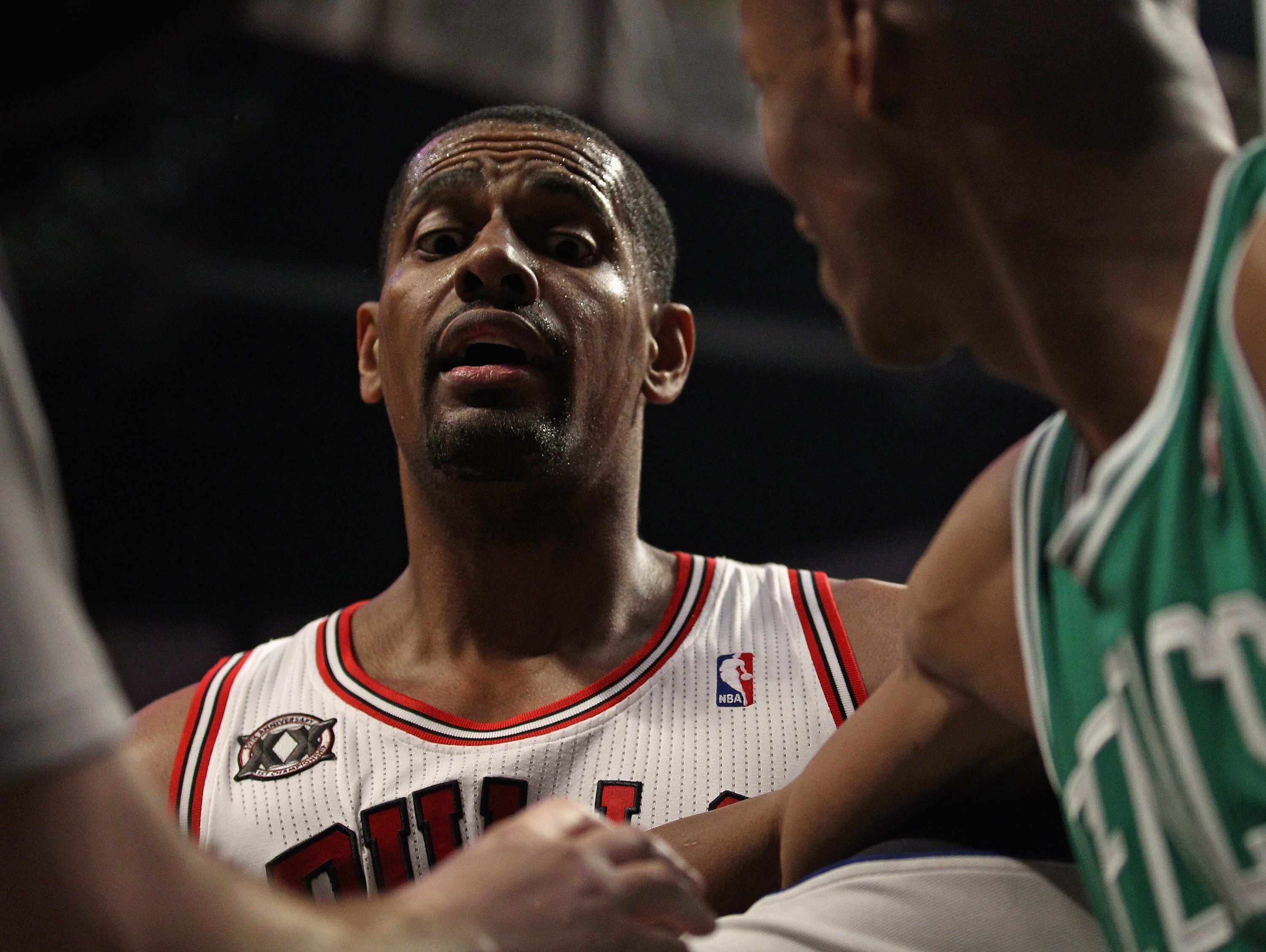 CHICAGO, IL - APRIL 07: Kurt Thomas #40 of the Chicago Bulls has words with Glen Davis of the Boston Celtics as Ray Allen #20 steps between them at United Center on April 7, 2011 in Chicago, Illinois. The Bulls defeated the Celtics 97-81. NOTE TO USER: Us