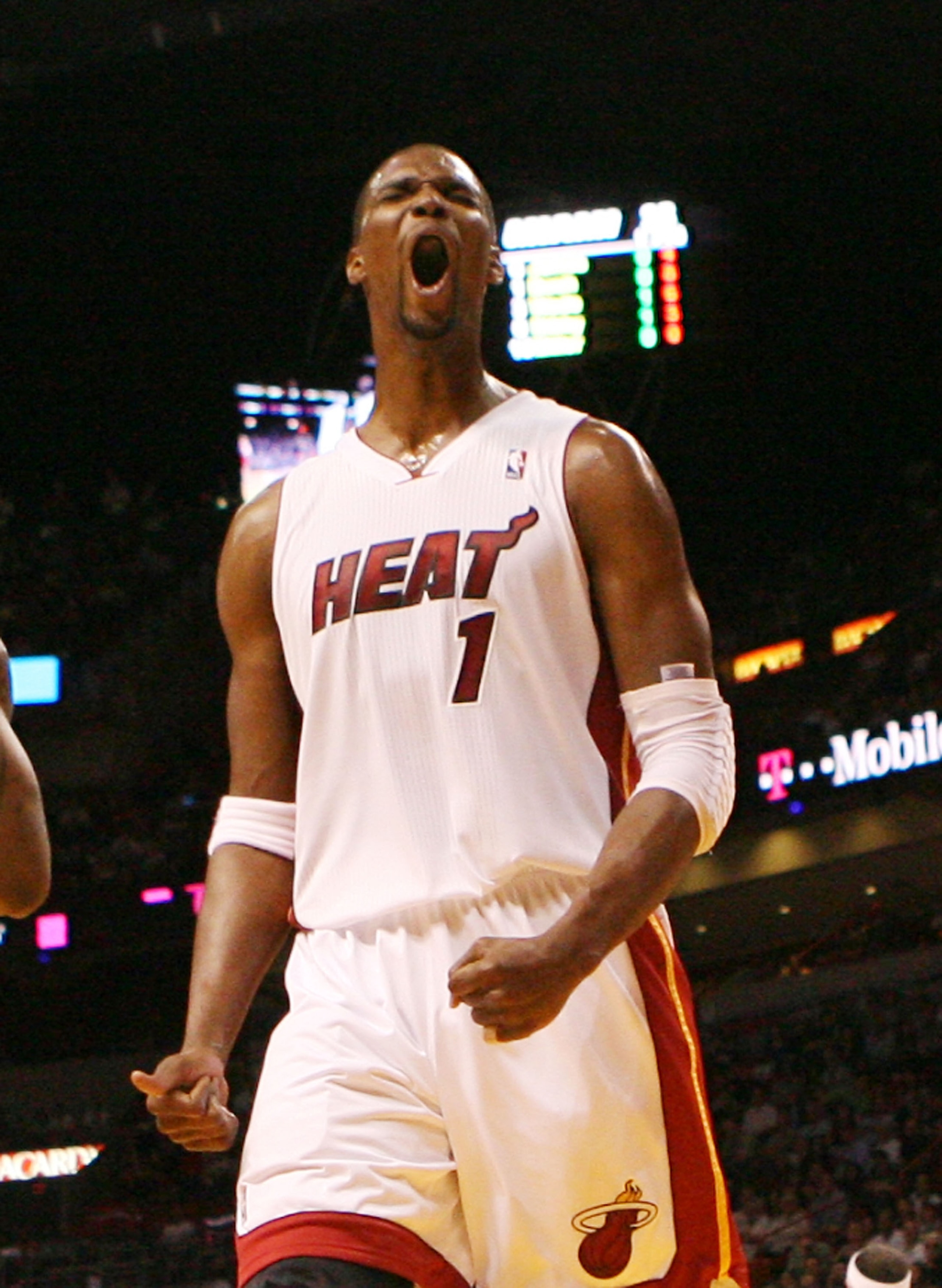 MIAMI, FL - MARCH 27: Forward Chris Bosh #1 of the Miami Heat reacts against the Houston Rockets at American Airlines Arena on March 27, 2011 in Miami, Florida. NOTE TO USER: User expressly acknowledges and agrees that, by downloading and/or using this Ph
