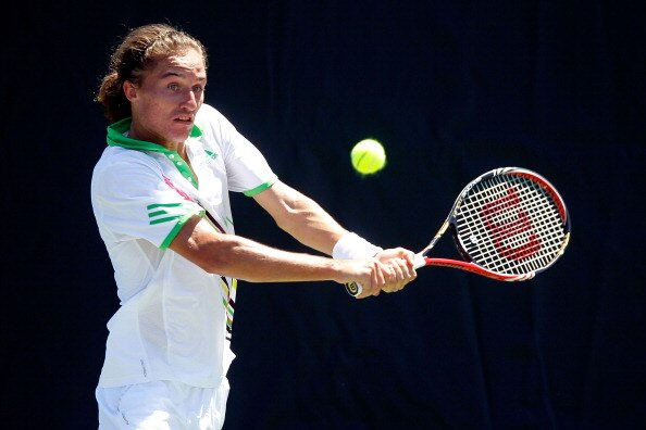 KEY BISCAYNE, FL - MARCH 26:  Alexandr Dolgopolov of the Ukraine returns against Andreas Seppi of Italy during the Sony Ericsson Open at Crandon Park Tennis Center on March 26, 2011 in Key Biscayne, Florida.  (Photo by Matthew Stockman/Getty Images)