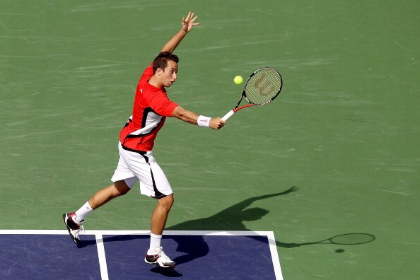 INDIAN WELLS, CA - MARCH 14: Philipp Kohlschreiber of Germany returns a shot to Robin Soderling of Sweden during the BNP Paribas Open at the Indian Wells Tennis Garden on March 14, 2011 in Indian Wells, California.  (Photo by Matthew Stockman/Getty Images