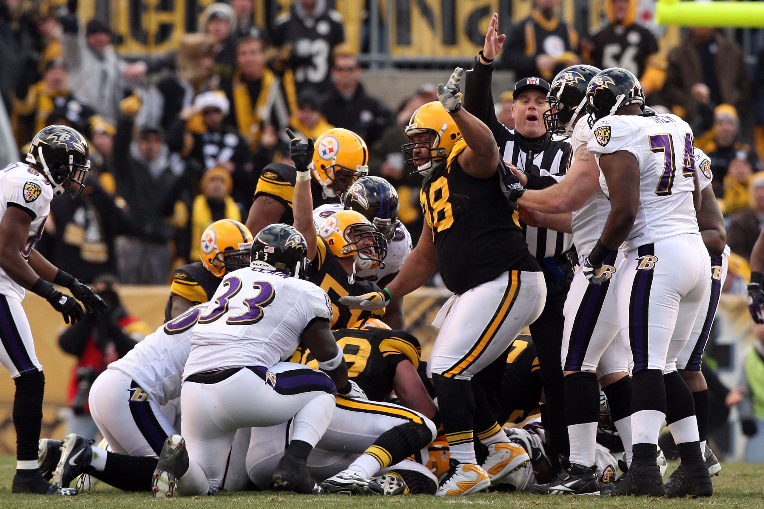 PITTSBURGH - DECEMBER 27: James Farrior #51 and Casey Hampton #98 signal Ike Taylor's fumble recovery for the Pittsburgh Steelers during the game against the Baltimore Ravens at Heinz Field on December 27, 2009 in Pittsburgh, Pennsylvania. (Photo by Kar PITTSBURGH - DECEMBER 27: James Farrior #51 and Casey Hampton #98 signal Ike Taylor's fumble recovery for the Pittsburgh Steelers during the game against the Baltimore Ravens at Heinz Field on December 27, 2009 in Pittsburgh, Pennsylvania. (Photo by Kar