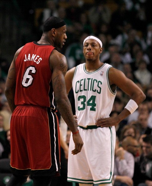BOSTON - FEBRUARY 13:  LeBron James #6 of the Miami Heat and Paul Pierce #34 of the Boston Celtics take a breather at TD Garden on February 13, 2011 in Boston, Massachusetts. NOTE TO USER: User expressly acknowledges and agrees that, by downloading and/or