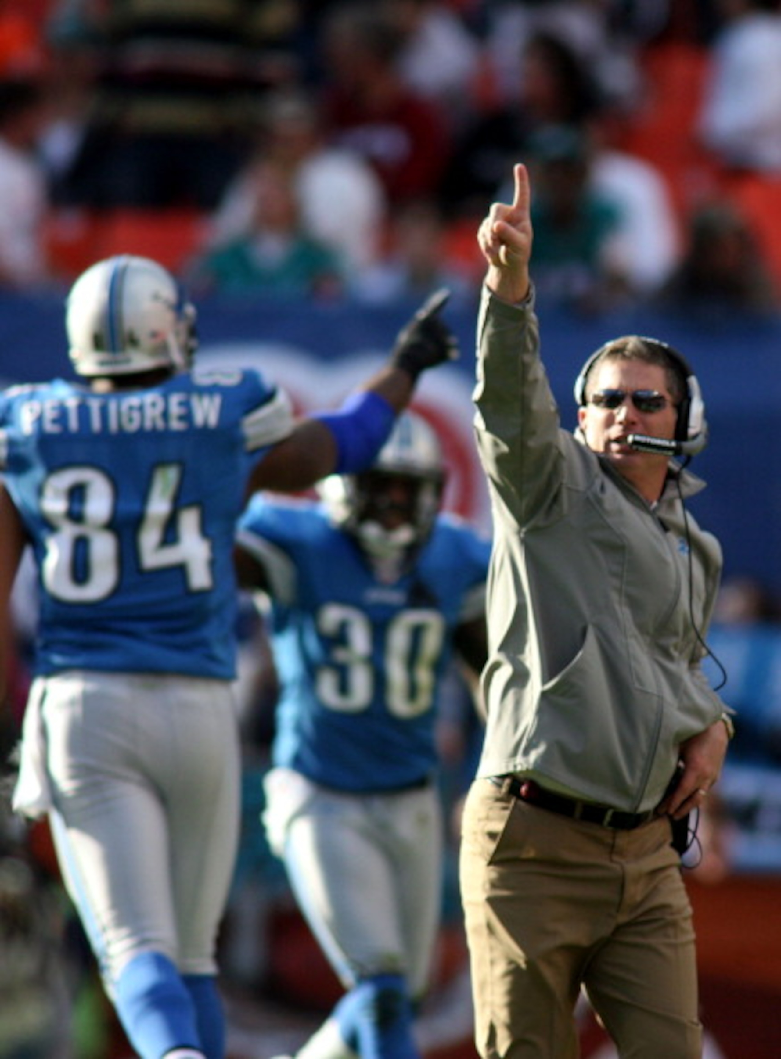 MIAMI - DECEMBER 26: Coach Jim Schwartz of the Detroit Lions celebrates a touchdown against the Miami Dolphins at Sun Life Stadium on December 26, 2010 in Miami, Florida. The Lions defeated the Dolphins 34-27.  (Photo by Marc Serota/Getty Images)