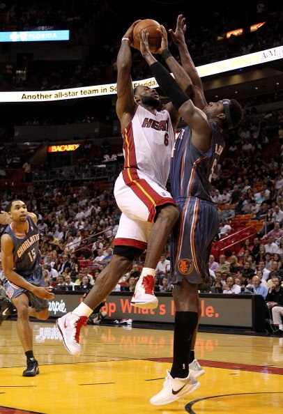 MIAMI, FL - APRIL 08:  LeBron James #6 of the Miami Heat drives against Kwame Brown #54 of the Charlotte Bobcats during a game at American Airlines Arena on April 8, 2011 in Miami, Florida. NOTE TO USER: User expressly acknowledges and agrees that, by dow