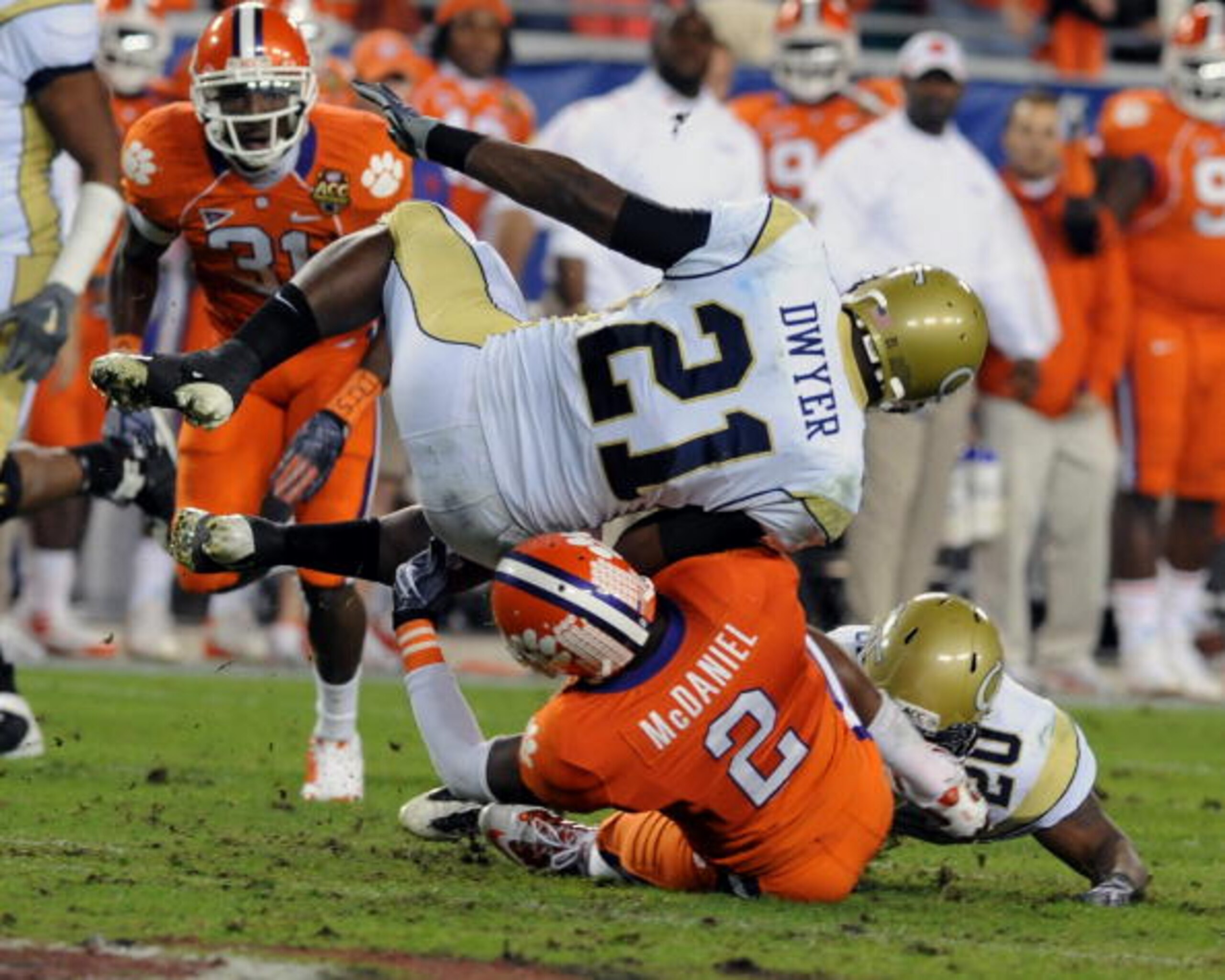 TAMPA, FL - DECEMBER 5: Running back Jonathan Dwyer #21 of the Georgia Tech Yellow Jackets tumbles for a gain against DeAndre McDaniel #2 of the Clemson Tigers in the 2009 ACC Football Championship Game December 5, 2009 at Raymond James Stadium in Tampa, TAMPA, FL - DECEMBER 5: Running back Jonathan Dwyer #21 of the Georgia Tech Yellow Jackets tumbles for a gain against DeAndre McDaniel #2 of the Clemson Tigers in the 2009 ACC Football Championship Game December 5, 2009 at Raymond James Stadium in Tampa,
