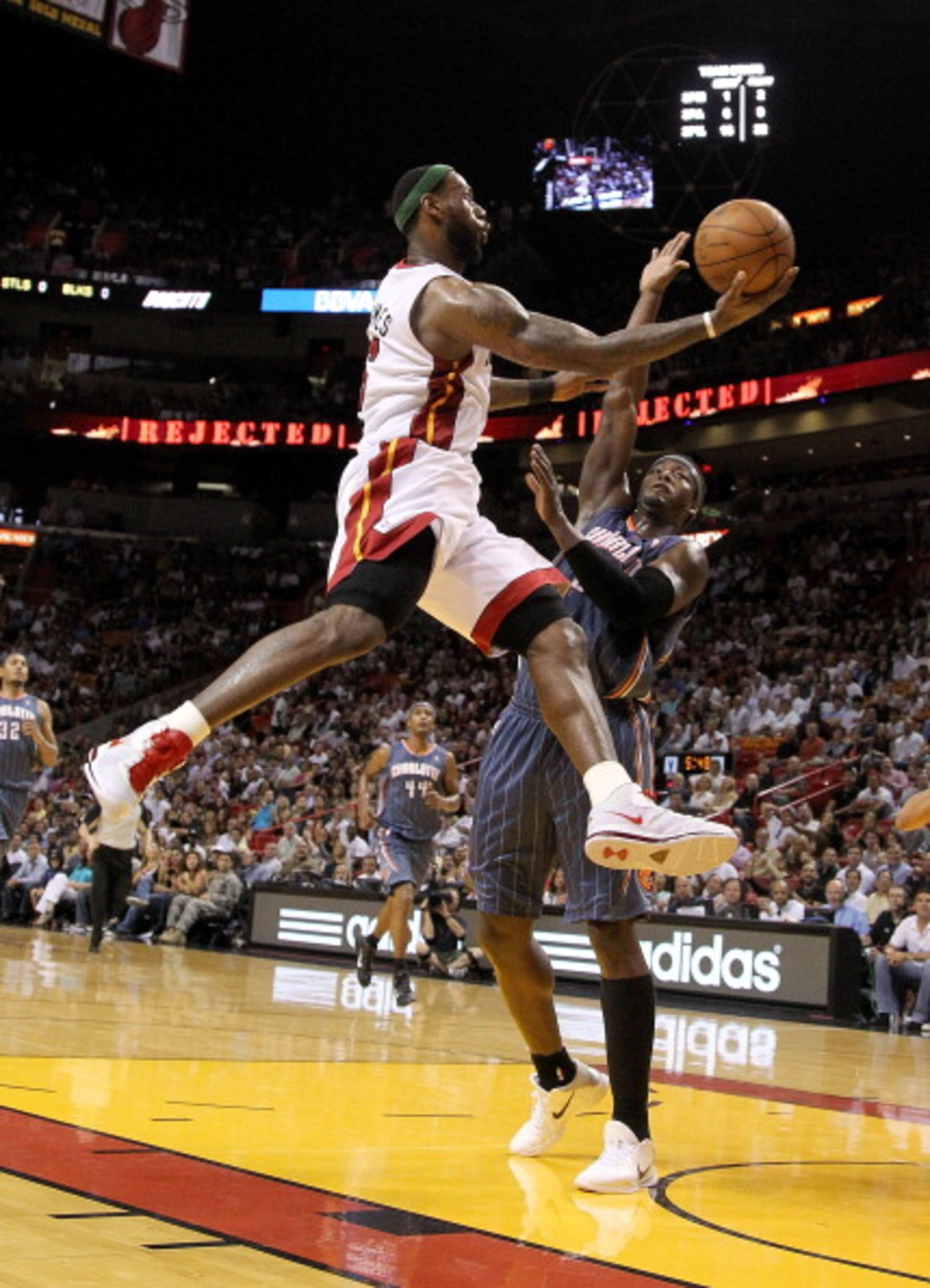 MIAMI, FL - APRIL 08:  LeBron James #6 of the Miami Heat drives against Kwame Brown #54 of the Charlotte Bobcats during a game at American Airlines Arena on April 8, 2011 in Miami, Florida. NOTE TO USER: User expressly acknowledges and agrees that, by dow