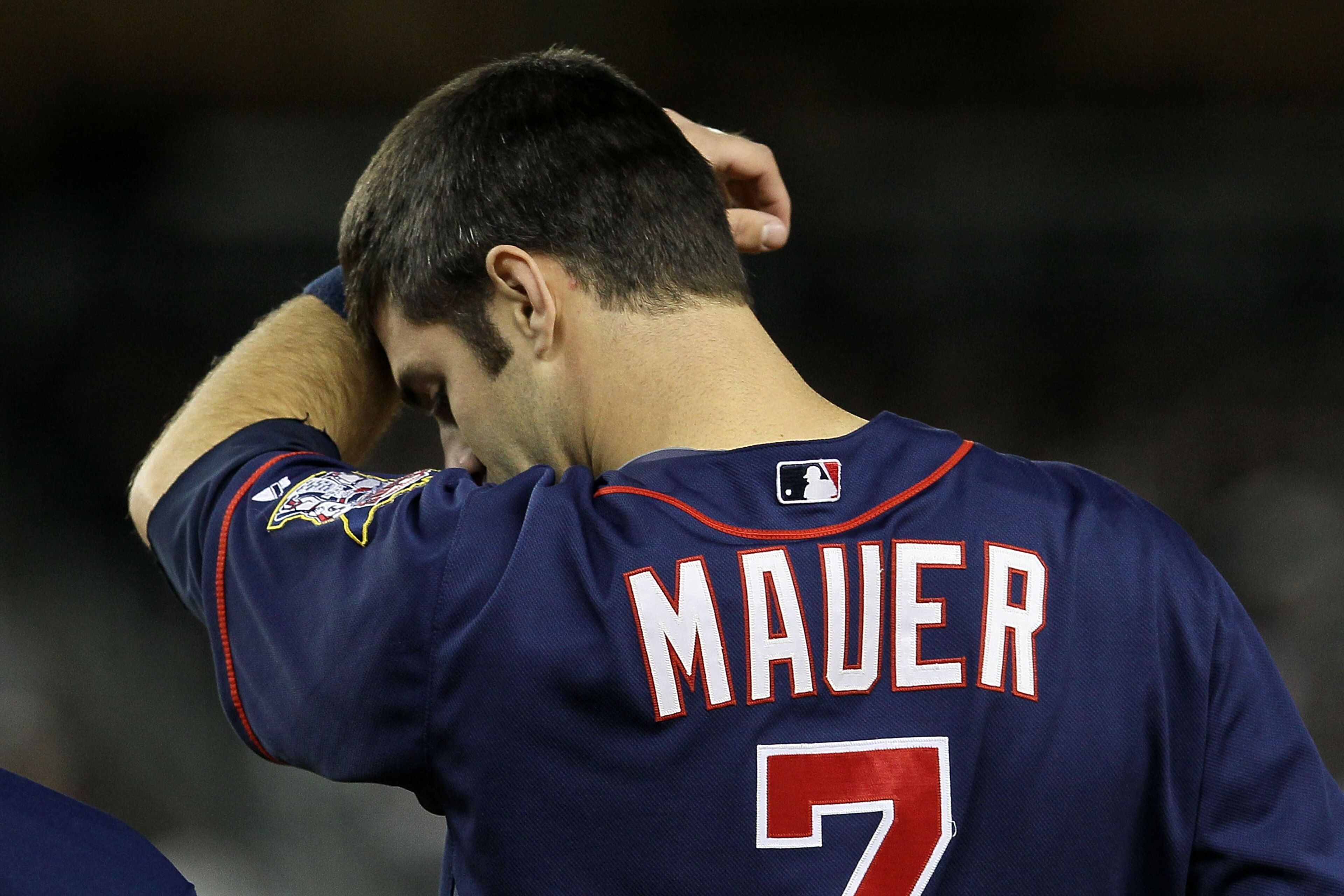 NEW YORK - OCTOBER 09: Joe Mauer #7 of the Minnesota Twins wipes his forehead against the New York Yankees during Game Three of the ALDS part of the 2010 MLB Playoffs at Yankee Stadium on October 9, 2010 in the Bronx borough of New York City. (Photo by NEW YORK - OCTOBER 09: Joe Mauer #7 of the Minnesota Twins wipes his forehead against the New York Yankees during Game Three of the ALDS part of the 2010 MLB Playoffs at Yankee Stadium on October 9, 2010 in the Bronx borough of New York City. (Photo by