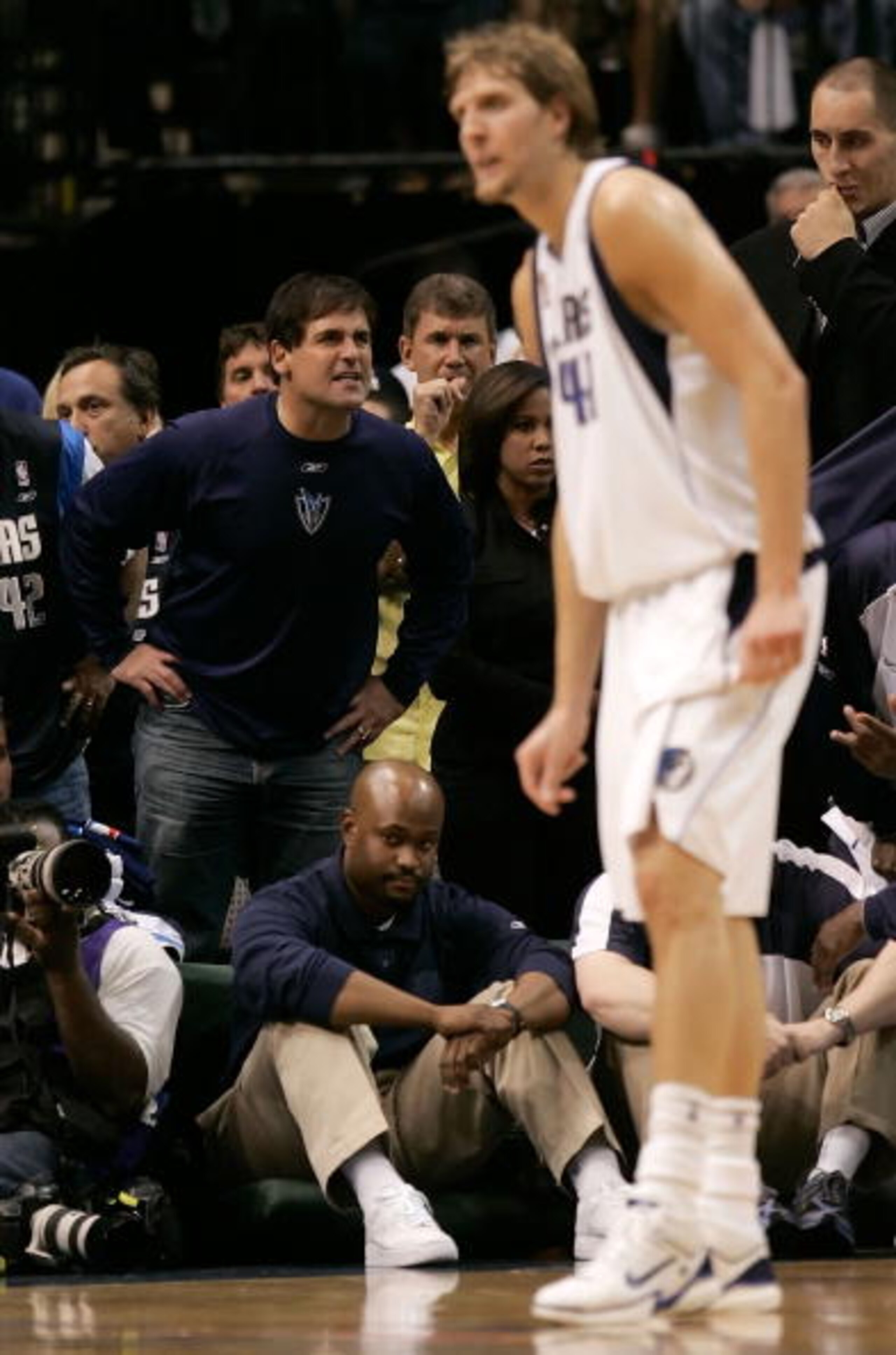 DALLAS - JUNE 20:  Owner Mark Cuban of the Dallas Mavericks yells to the court as Dirk Nowitzki #41 of the Mavericks stands in the foreground in game six of the 2006 NBA Finals against the Miami Heat on June 20, 2006 at American Airlines Center in Dallas,