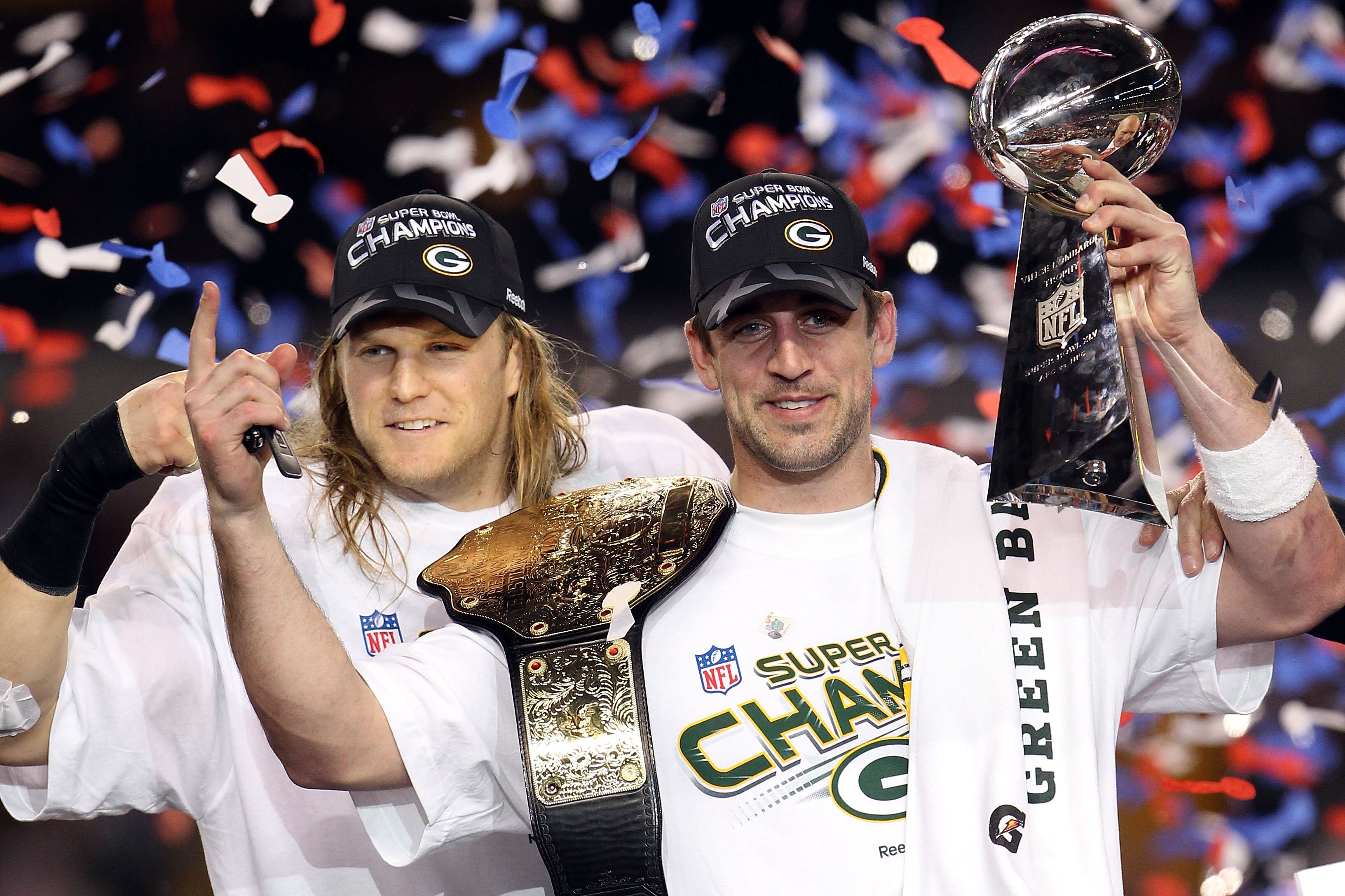 ARLINGTON, TX - FEBRUARY 06:  Aaron Rodgers #12 and Clay Matthews #52 of the Green Bay Packers of the Green Bay Packers holds the Lombardi Trophy after defeating the Pittsburgh Steelers 31-25 during Super Bowl XLV at Cowboys Stadium on February 6, 2011 in