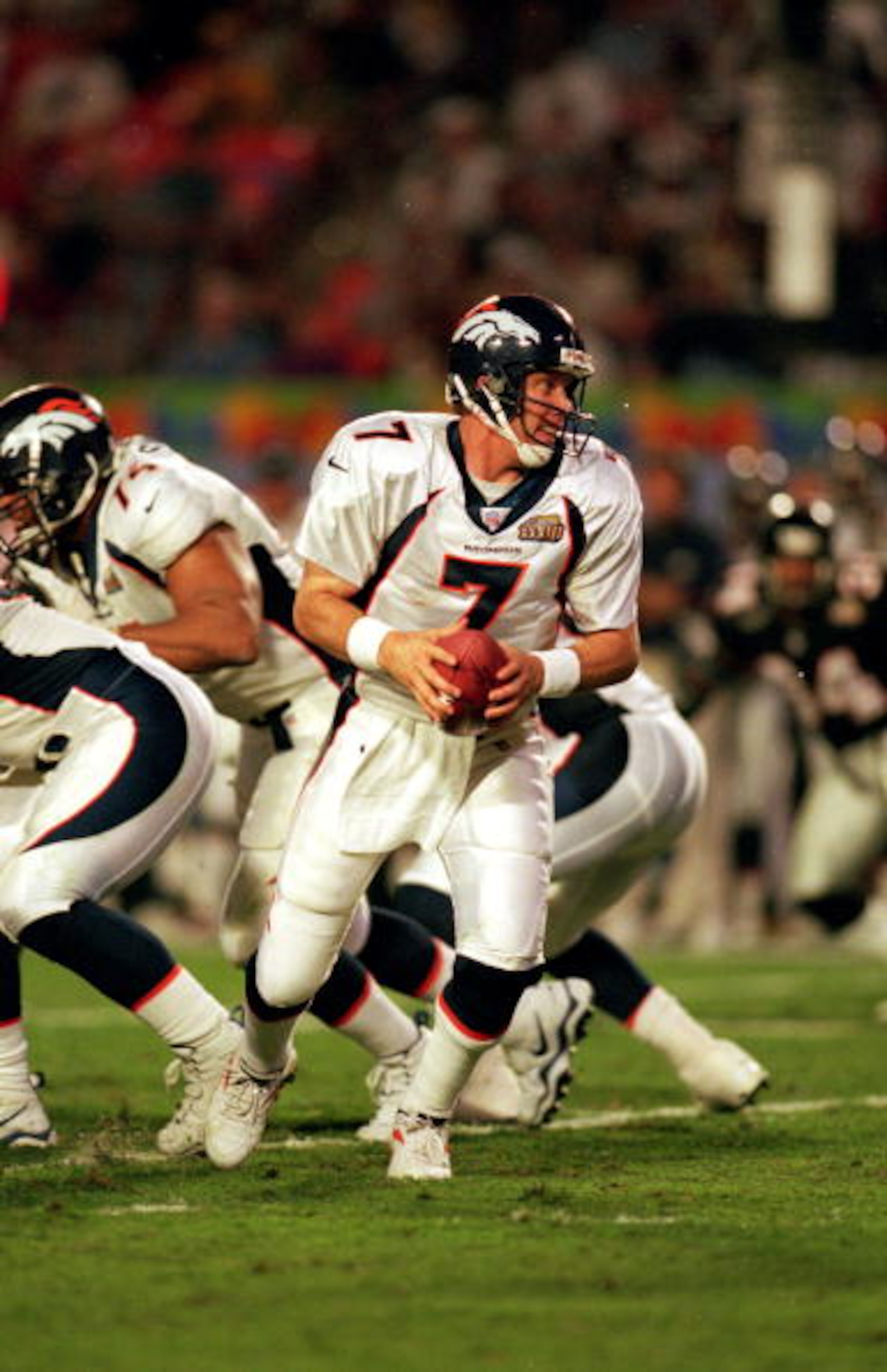 31 Jan 1999:   John Elway #7 of the Denver Broncos moves back after the snap during the Superbowl XXXIII against the Atlanta Falcons at the Pro Player Stadium in Miami, Florida. The Broncos defeated the Falcons  34-19. Mandatory Credit: Andy Lyons  /Allsp