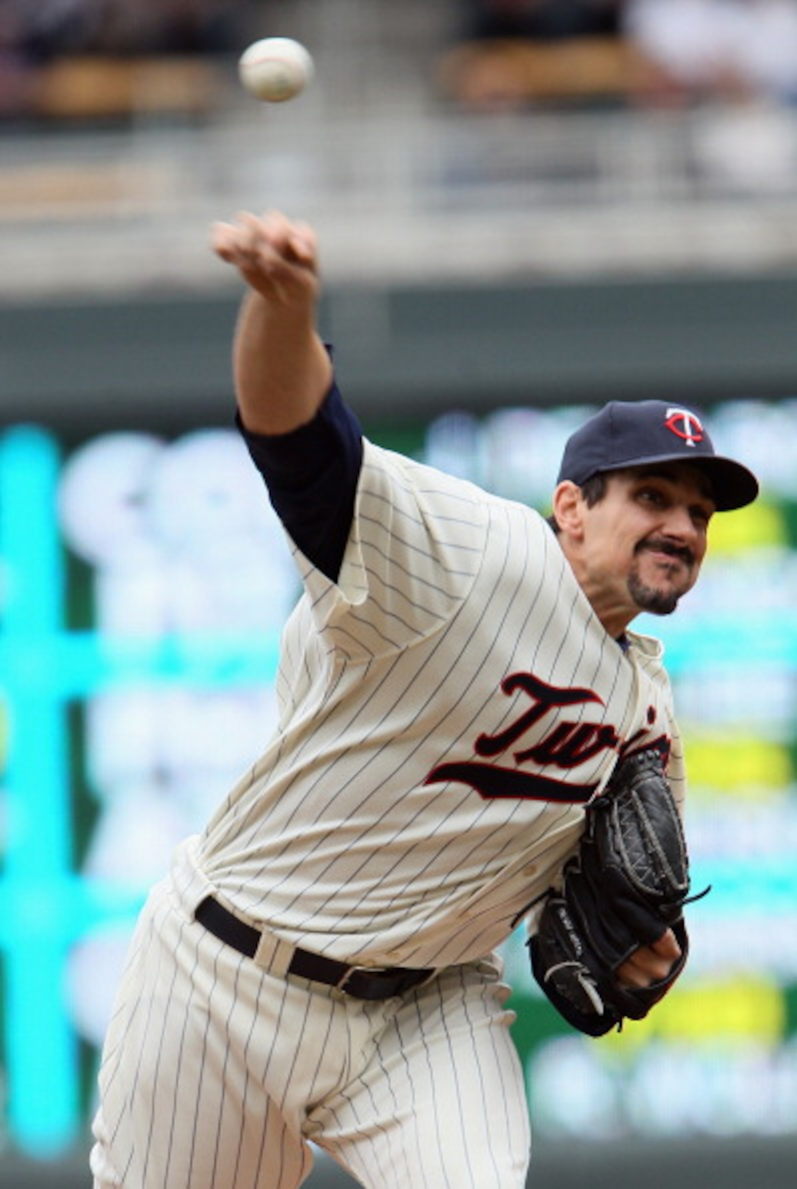 MINNEAPOLIS, MN - APRIL 08:  Carl Pavano #48 of the Minnesota Twins delivers a pitch against the Oakland Athletics during Opening Day on April 8, 2011 at Target Field in Minneapolis, Minnesota.  (Photo by Elsa/Getty Images)