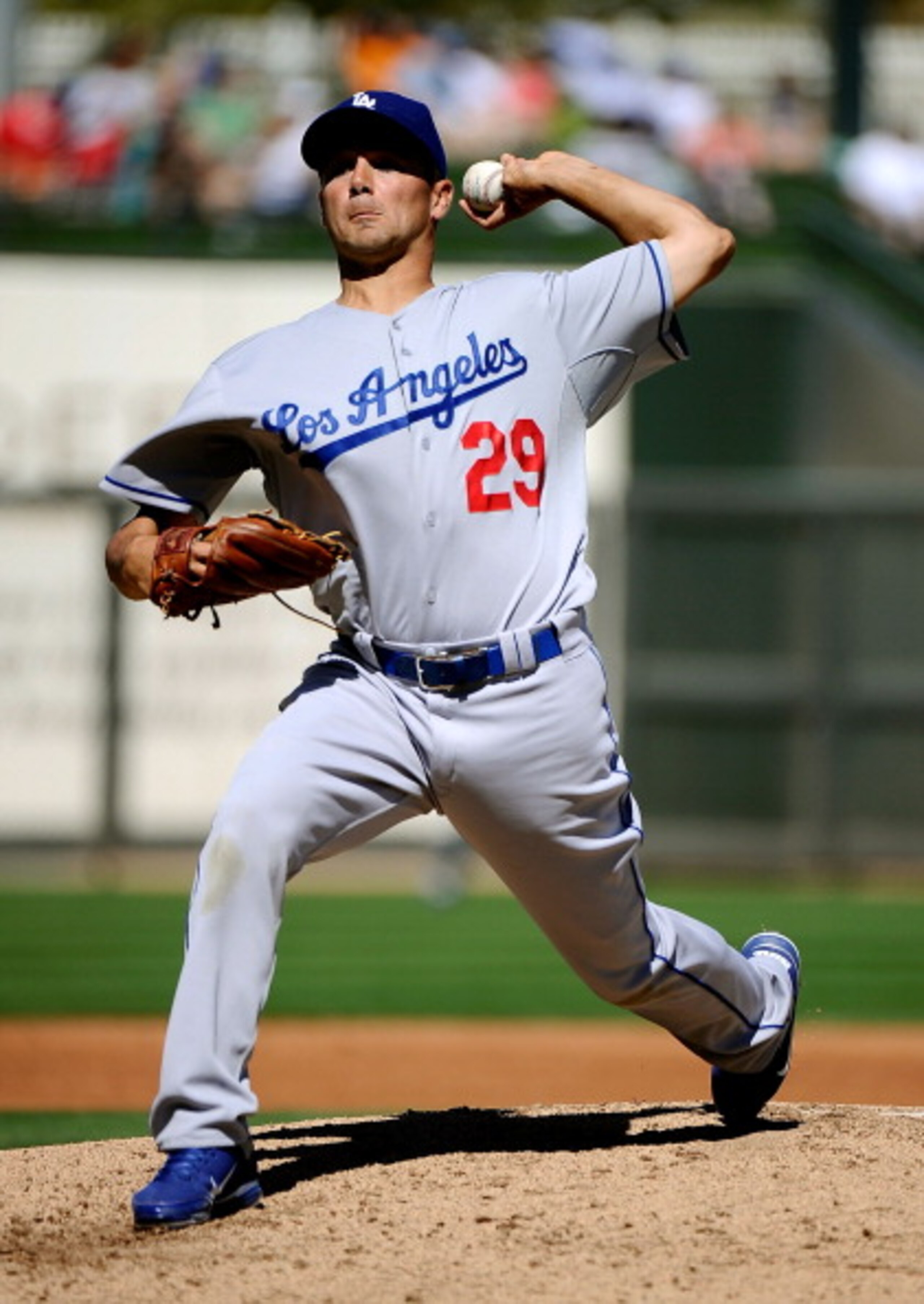 SURPRISE, AZ - MARCH 12:  Pitcher Ted Lilly #29 of the the Los Angeles Dodgers  throws a pitch during the spring training baseball game against the Kansas City Royals at Surprise Stadium on March 12, 2011 in Surprise, Arizona.  (Photo by Kevork Djansezian
