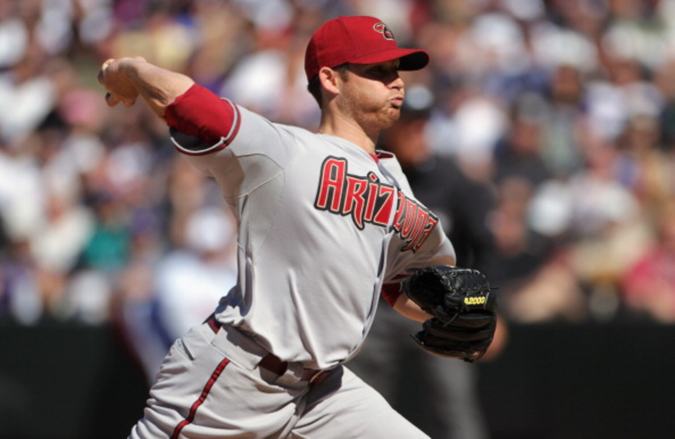 DENVER, CO - APRIL 01:  Starting pitcher Ian Kennedy #31 of the Arizona Diamondbacks delivers against the Colorado Rockies during Opening Day at Coors Field on April 1, 2011 in Denver, Colorado.  (Photo by Doug Pensinger/Getty Images)