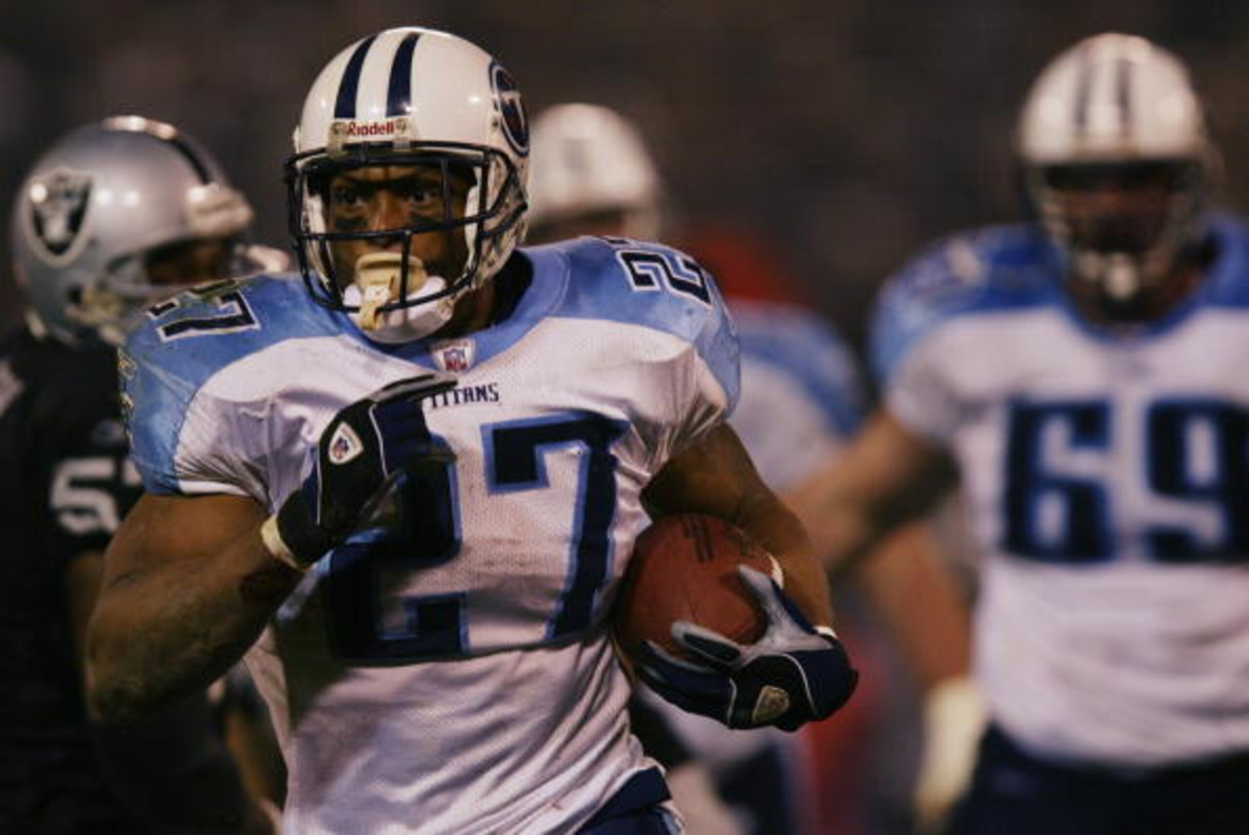 OAKLAND, CA - JANUARY 19:  Runningback Eddie George #27 of the Tennessee Titans gets loose during the AFC Championship game against the Oakland Raiders at Network Associates Coliseum on January 19, 2003 in Oakland, California.  The Raiders defeated the Ti