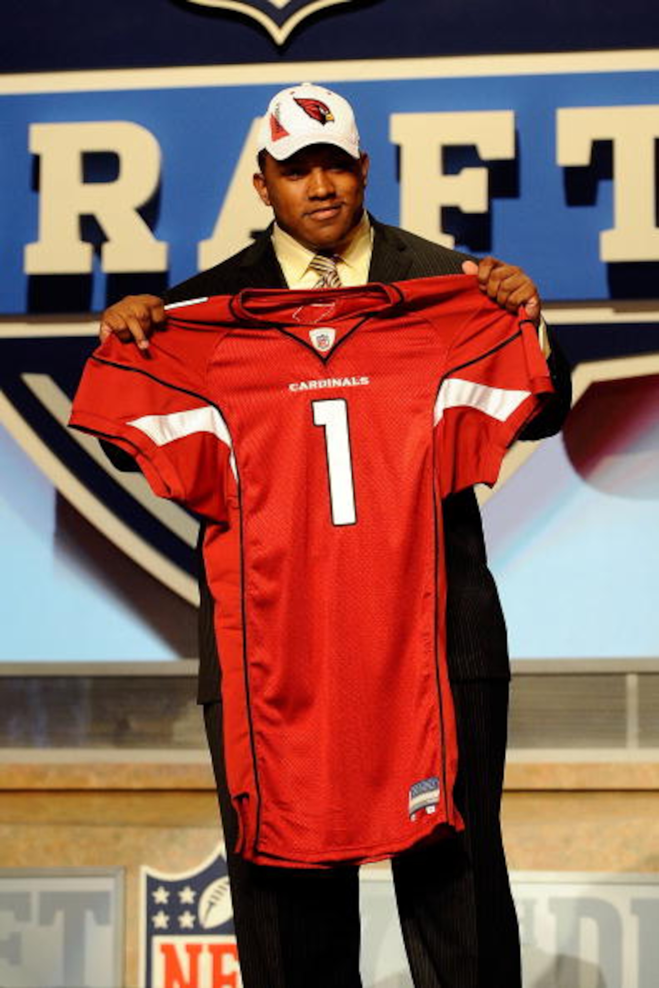 NEW YORK - APRIL 22:  Dan Williams from the Tennessee Volunteers holds up a Arizona Cardinals jersey after he was selected number 26 overall by the Cardinals during the first round of the 2010 NFL Draft at Radio City Music Hall on April 22, 2010 in New Yo