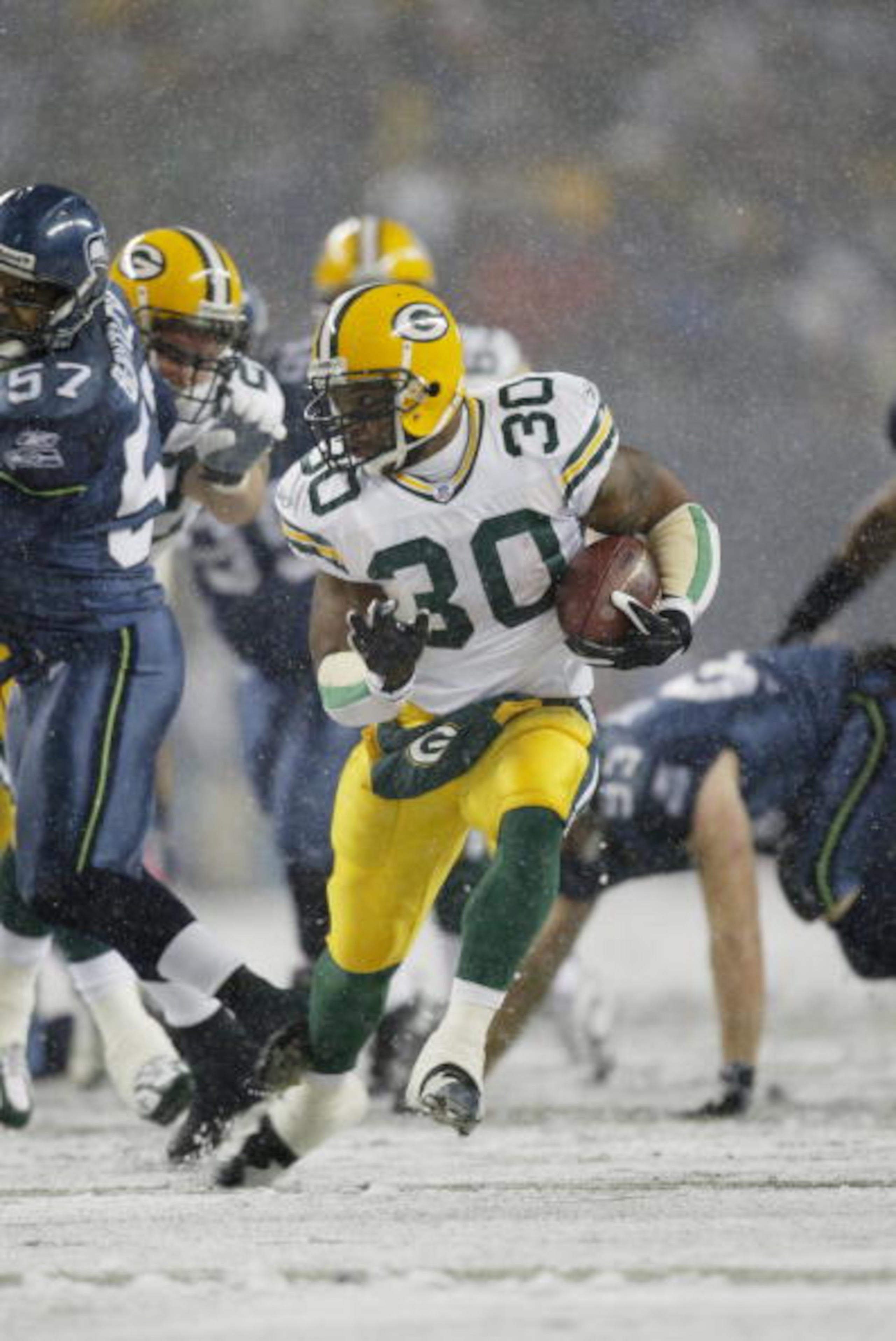 SEATTLE - NOVEMBER 27:  Running back Ahman Green #30 of the Green Bay Packers runs with the ball against the Seattle Seahawks on November 27, 2006 at Qwest Field in Seattle, Washington. The Seahawks defeated the Packers 34-24. (Photo by Otto Greule Jr/Get