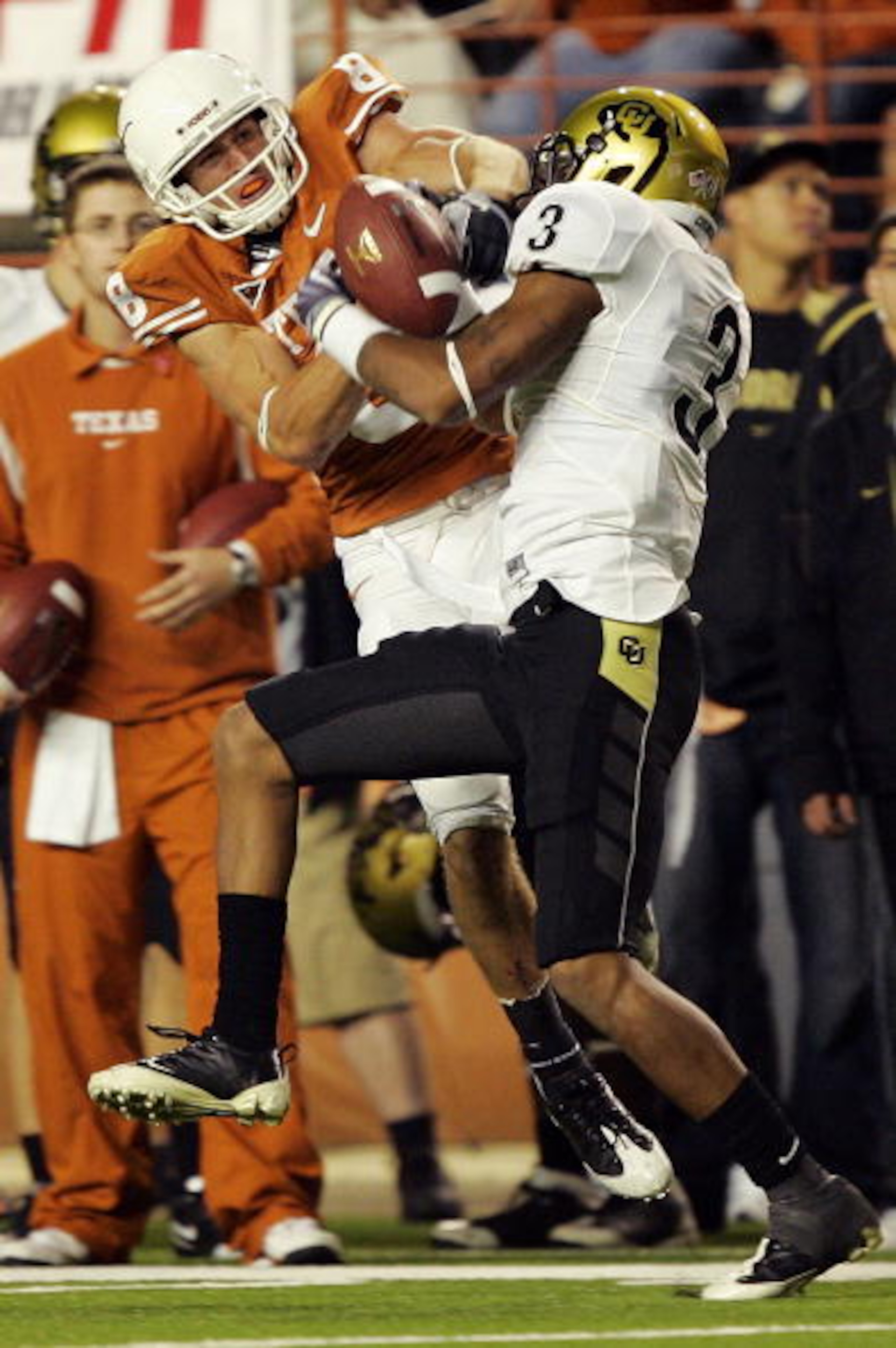 AUSTIN, TX - OCTOBER 10: Jordan Shipley #8 of the Texas Longhorns wrestles for control of the ball with cornerback Jimmy Smith #3 of the Colorado Buffaloes for an incomplete pass on October 10, 2009 at Darrell K Royal-Texas Memorial Stadium in Austin, Tex
