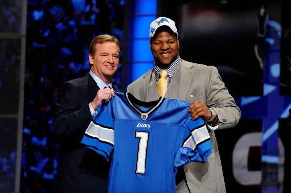 NEW YORK - APRIL 22:  Ndamukong Suh (R) from the Nebraska Cornhuskers poses with NFL Commissioner Roger Goodell as they hold up a Detroit Lions jersey after Suh was selected by the Lions number 2 overall during the first round of the 2010 NFL Draft at Rad