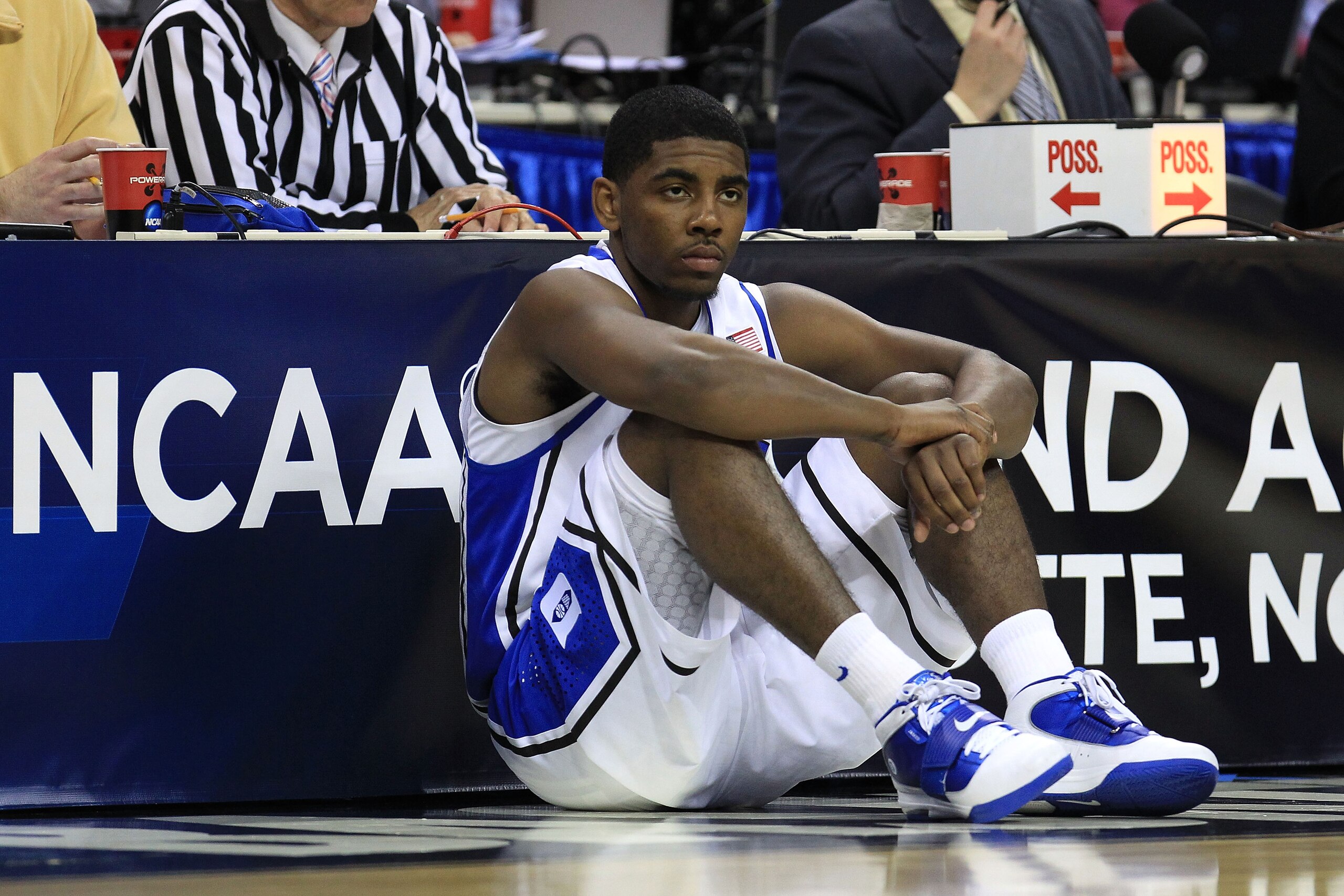 CHARLOTTE, NC - MARCH 20: Kyrie Irving #1 of the Duke Blue Devils waits to enter the game while taking on the Michigan Wolverines during the third round of the 2011 NCAA men's basketball tournament at Time Warner Cable Arena on March 20, 2011 in Charlott CHARLOTTE, NC - MARCH 20: Kyrie Irving #1 of the Duke Blue Devils waits to enter the game while taking on the Michigan Wolverines during the third round of the 2011 NCAA men's basketball tournament at Time Warner Cable Arena on March 20, 2011 in Charlott
