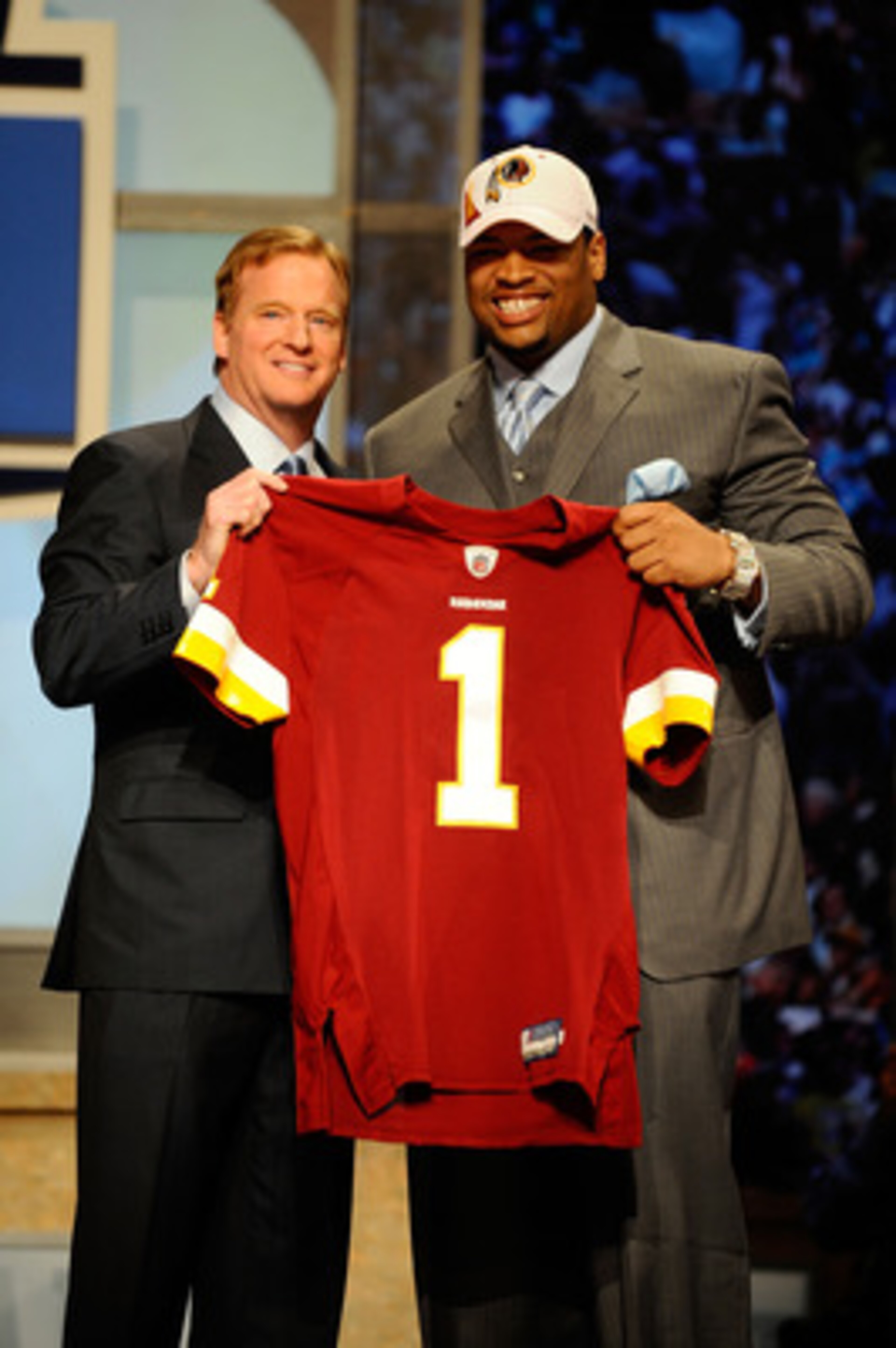 NEW YORK - APRIL 22:  Trent Williams (R) of the Oklahoma Sooners poses with NFL Commissoner Roger Goodell as they hold a Washington Redskins jersey after Washington selected Williams #4 overall during the 2010 NFL Draft at Radio City Music Hall on April 2